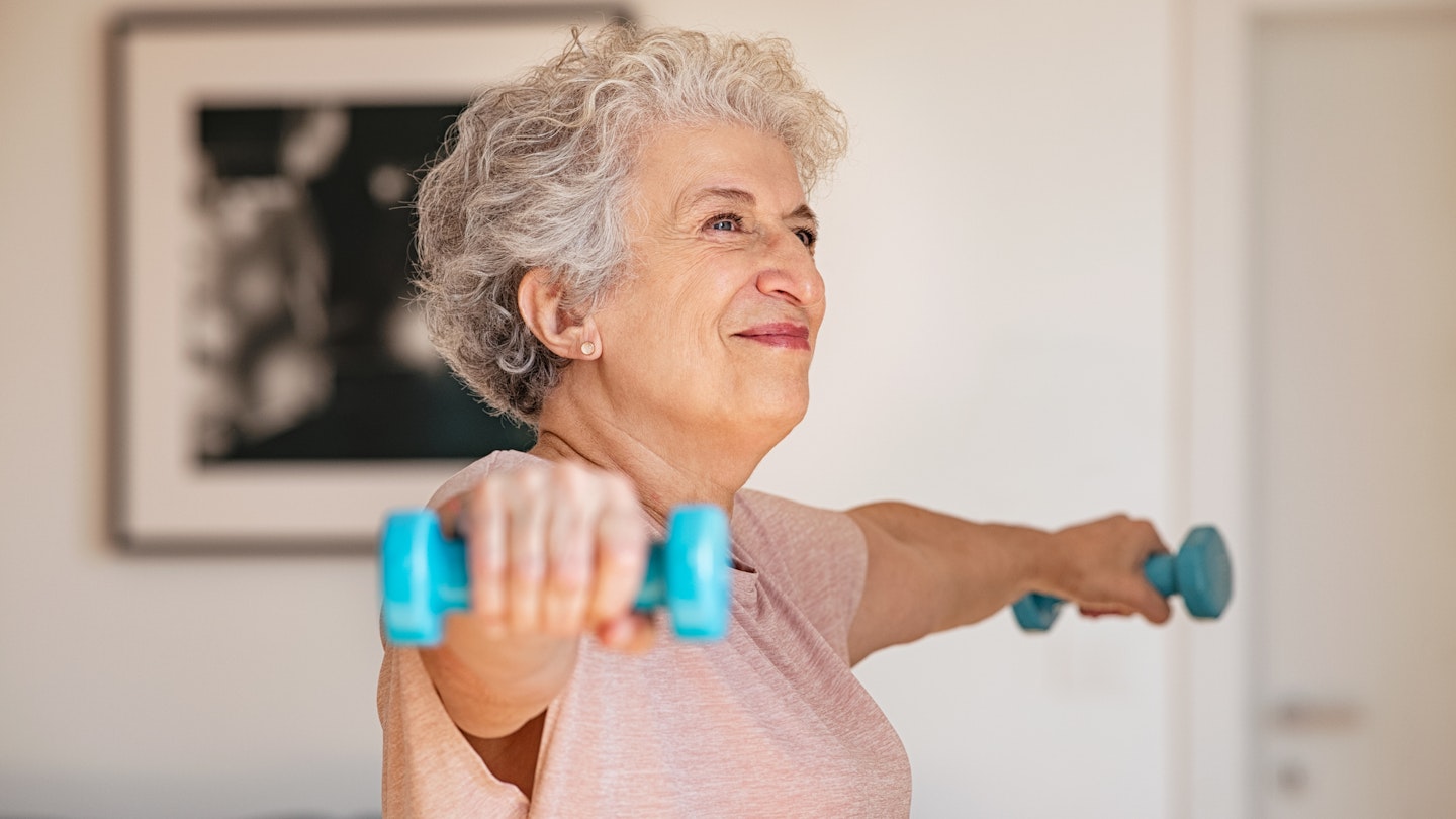 Woman holding dumbbells