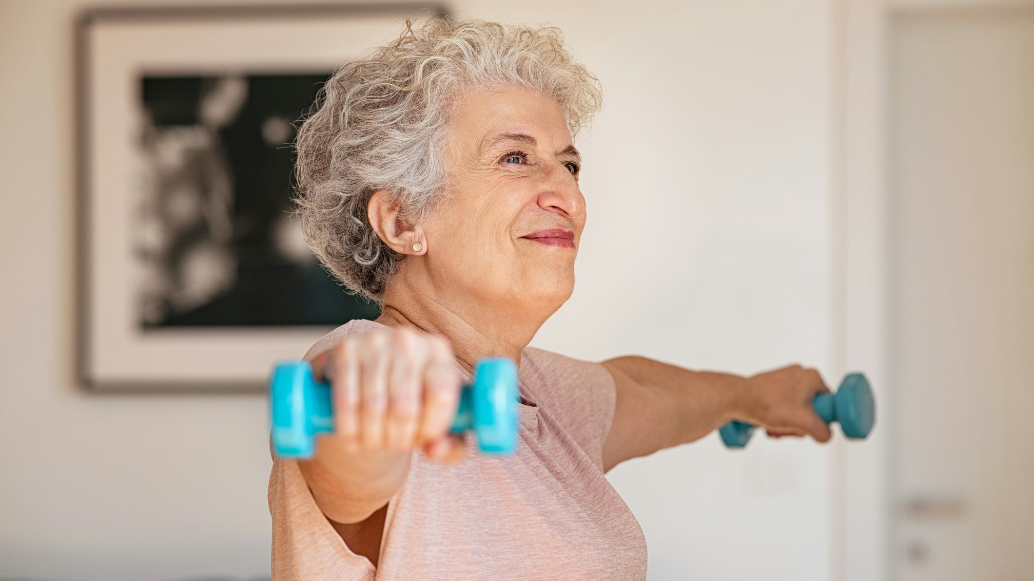 Woman holding dumbbells