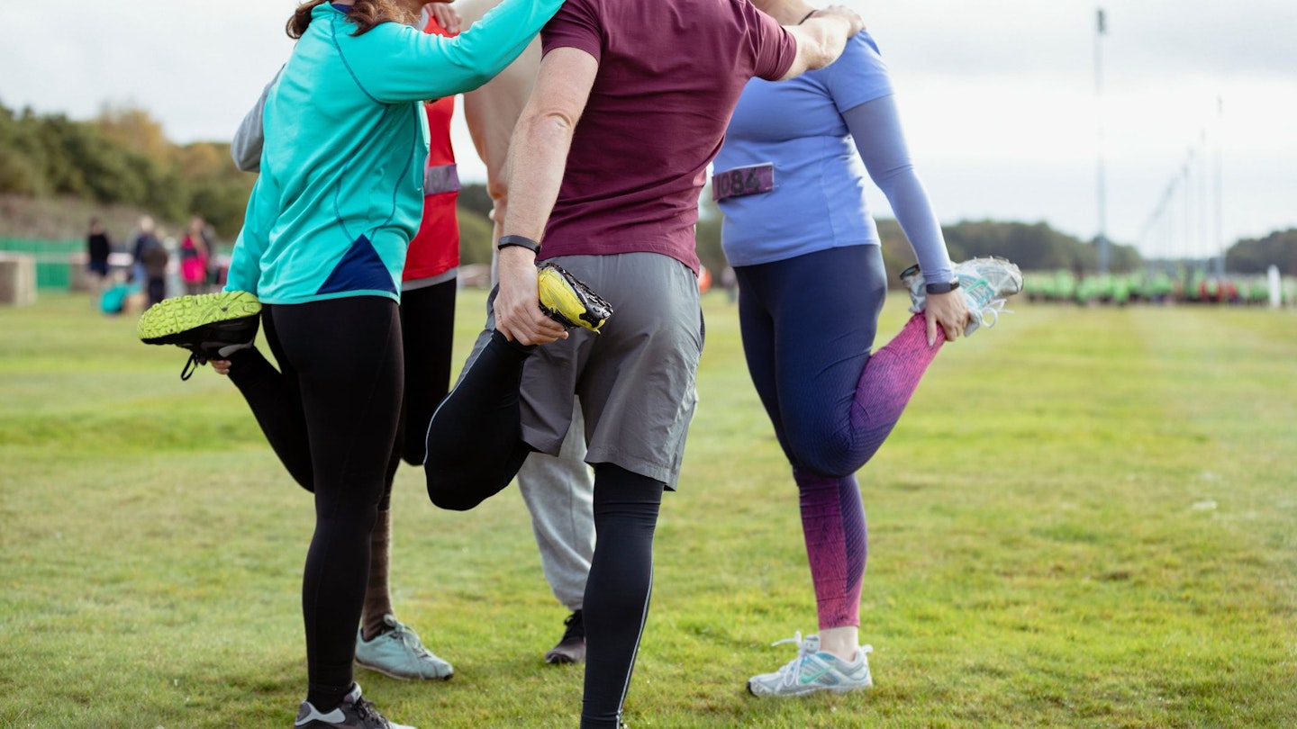 Group of people doing quad stretch