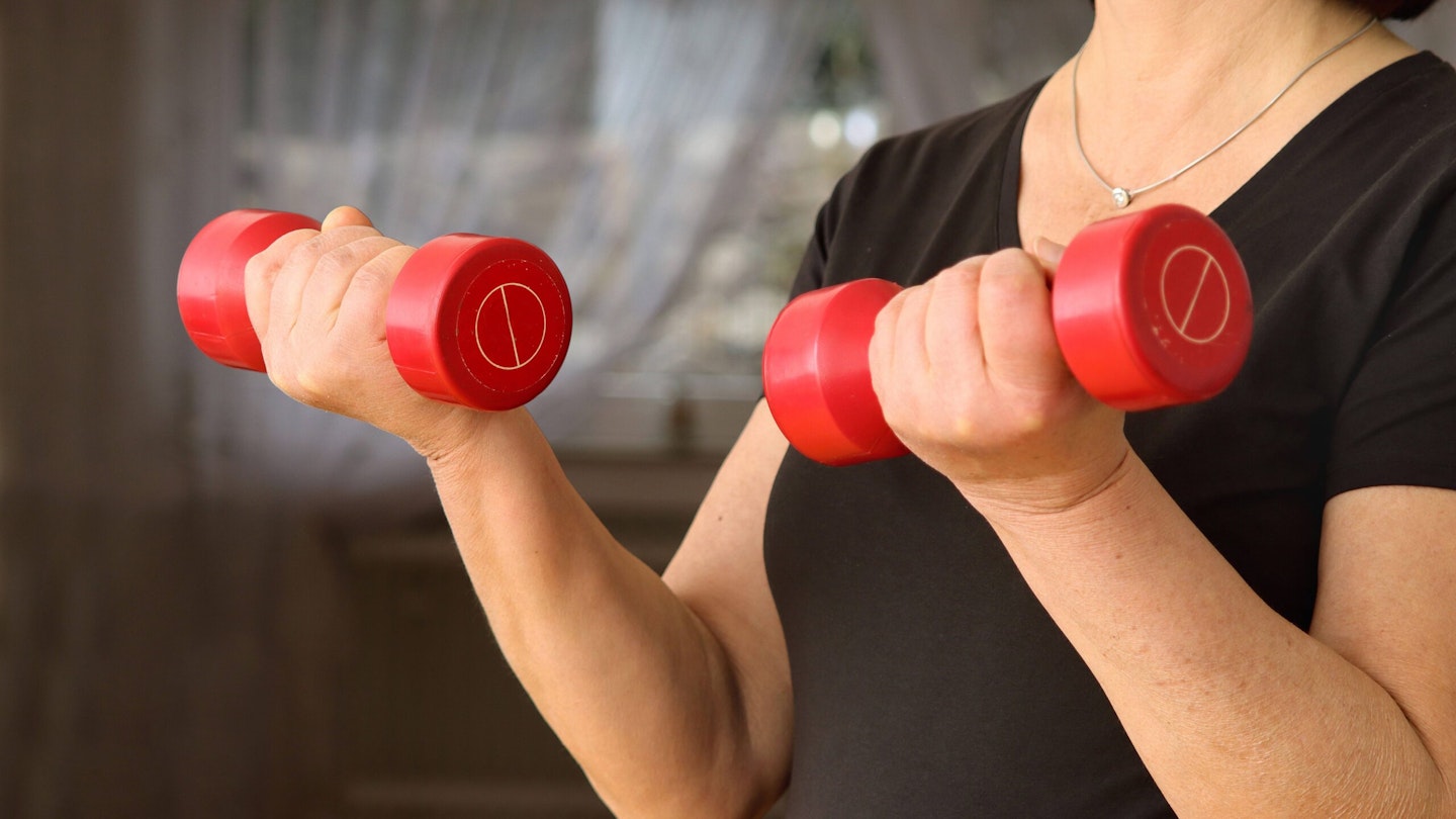 Woman lifting dumbbells