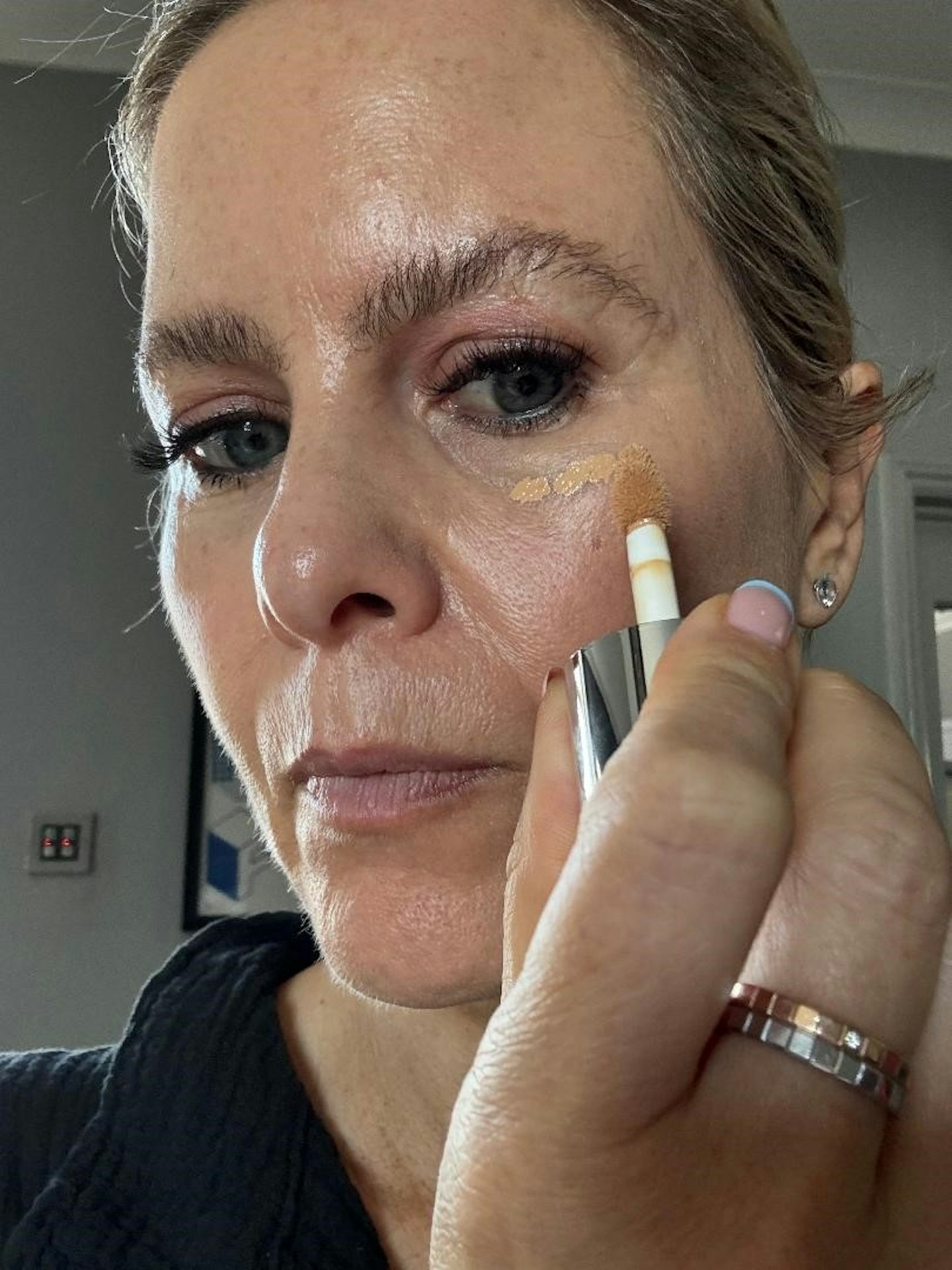 Product tester using Milk Makeup Future Fluid All Over Cream Concealer