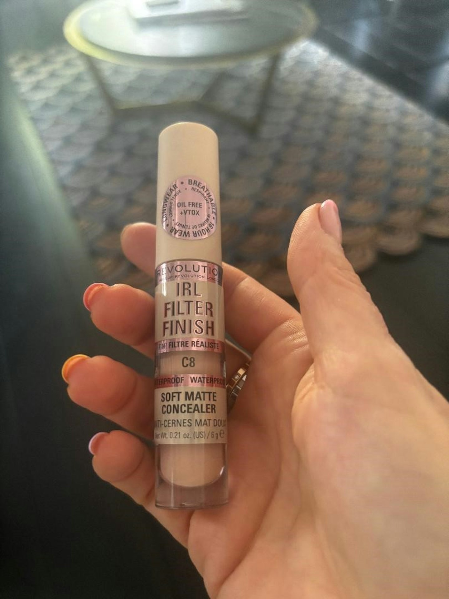 Product tester with Makeup Revolution IRL Filter Finish Concealer