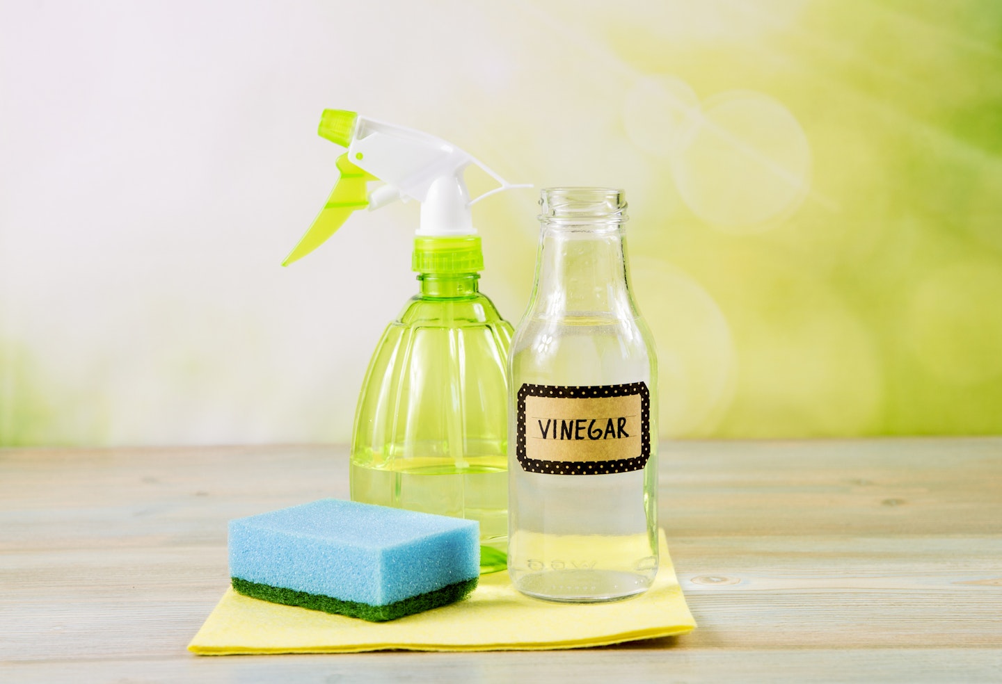 vinegar, spray bottle and scrub