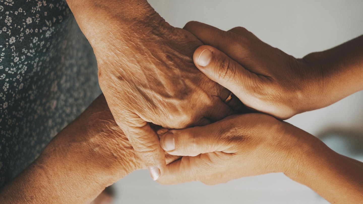 Older and younger woman hands