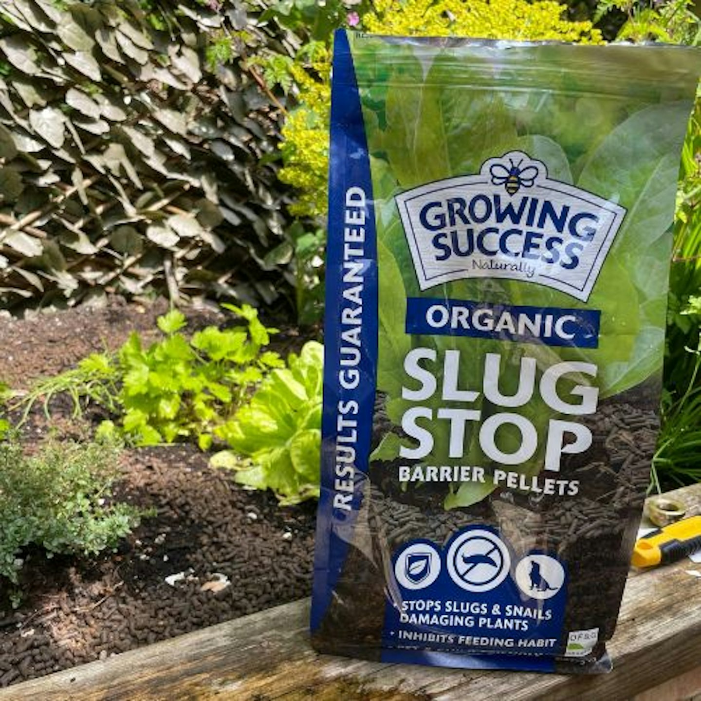 Organic Slug Stop Pellet Barrier Pouch - in the garden