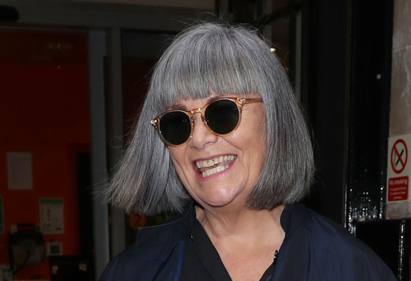 Dawn French in a pair of black sunglasses with a silver bob