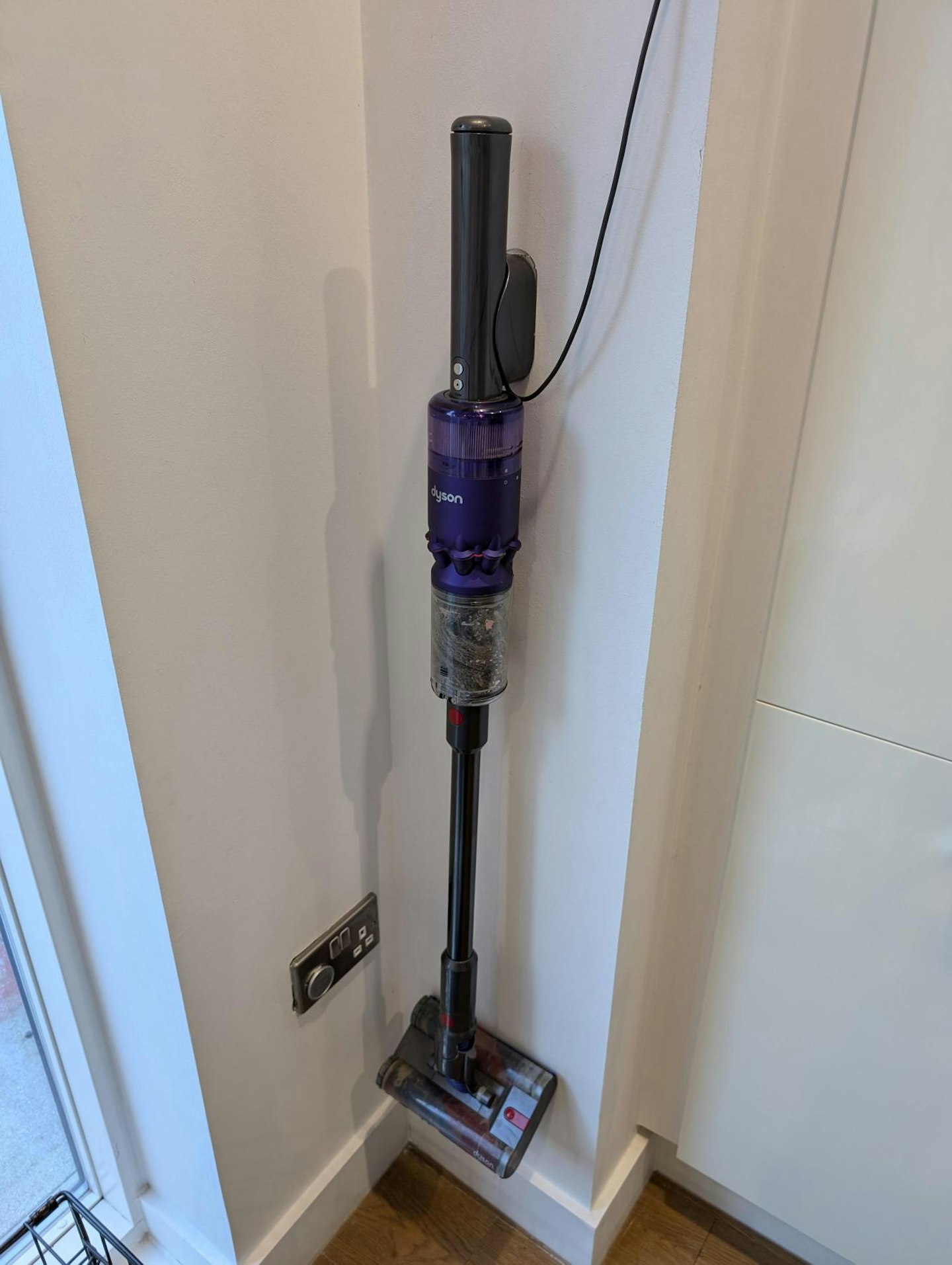 Dyson Omni-glide in its holder