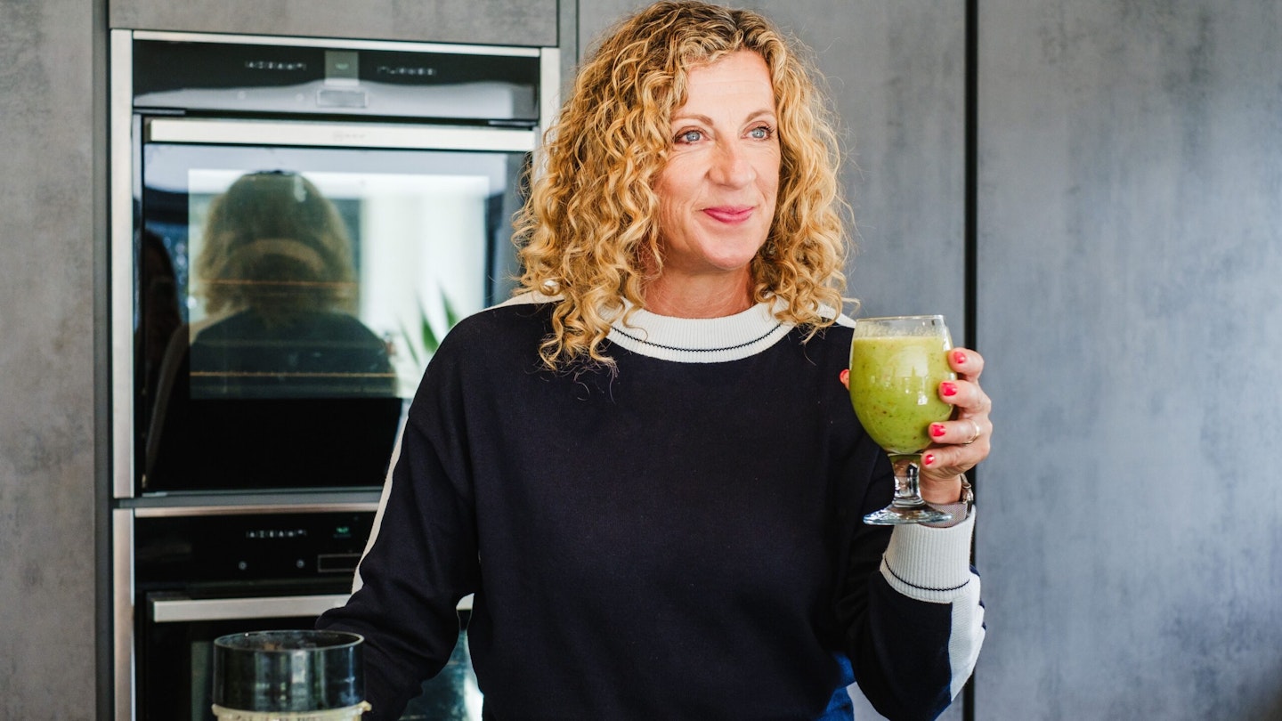 Sally Gunnell with a glass of green juice