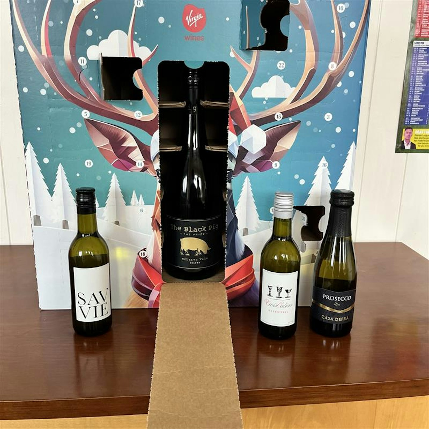 Virgin Wines mixed wine advent calendar inside with some doors open and mini bottles of wine on display 