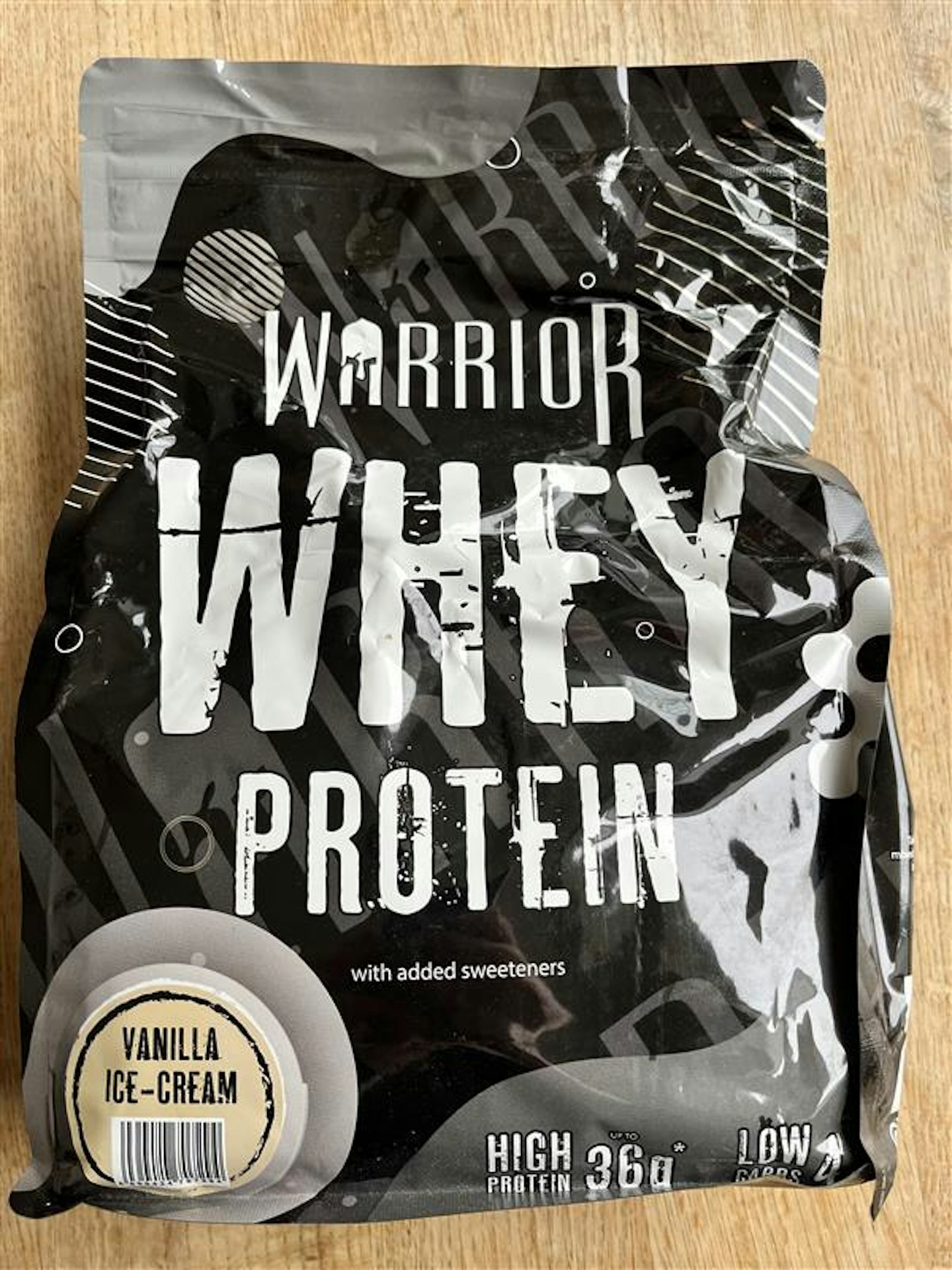 A bag of Warrior Whey protein, vanilla ice cream flavour 