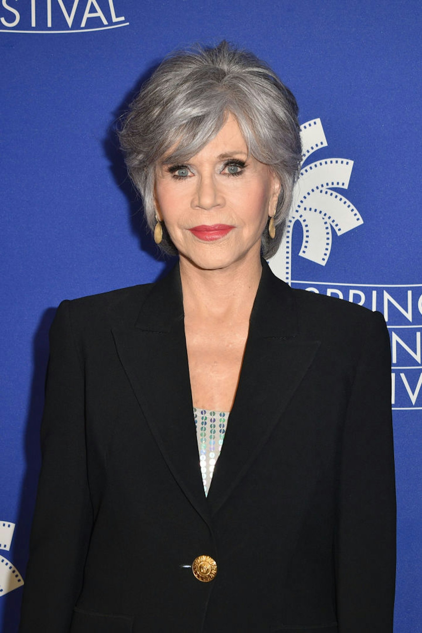 Jane Fonda with a bouncy bob in a black blazer