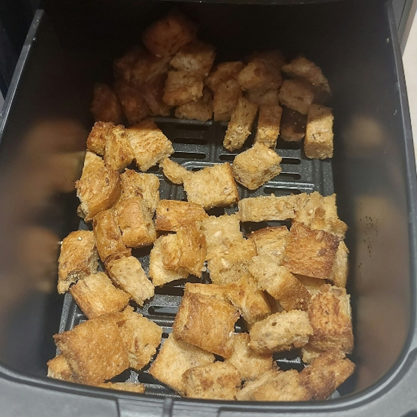 food being cooked in the Ultenic K20 Dual Basket Air Fryer