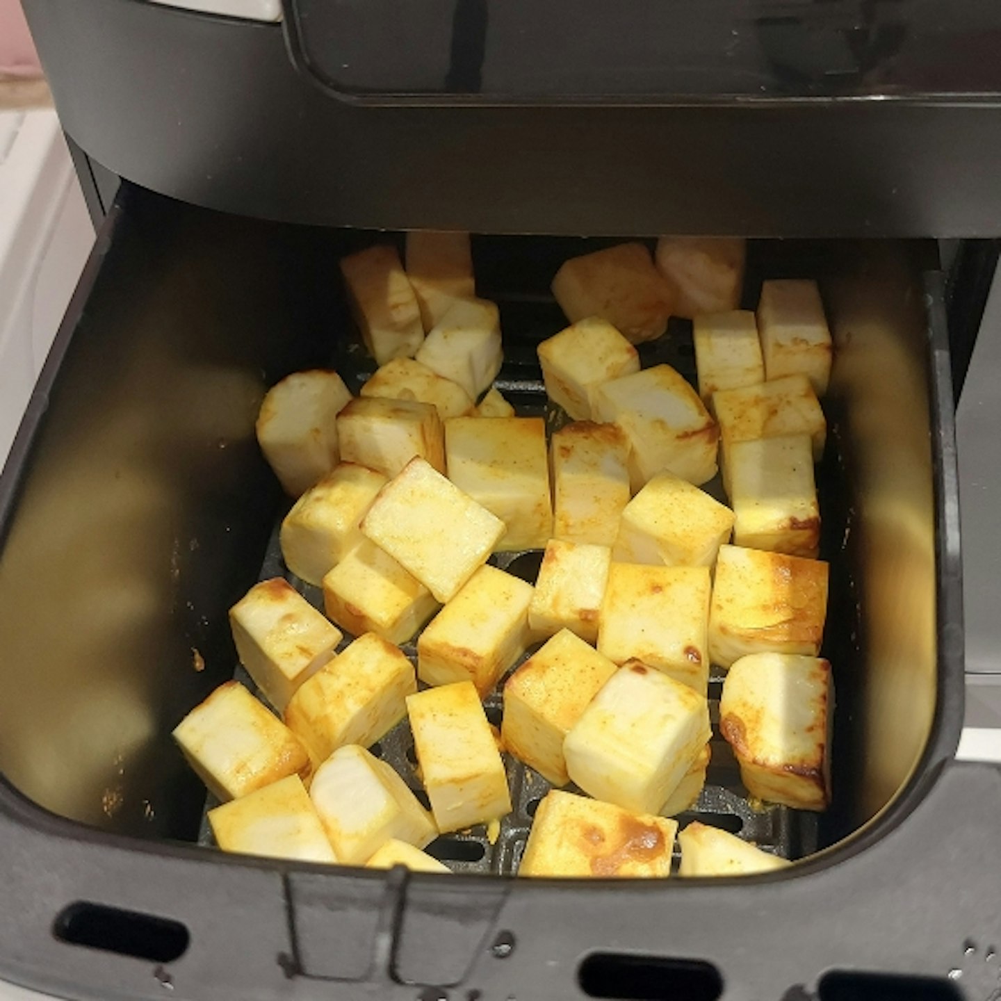 food being cooked in the Ultenic K20 Dual Basket Air Fryer