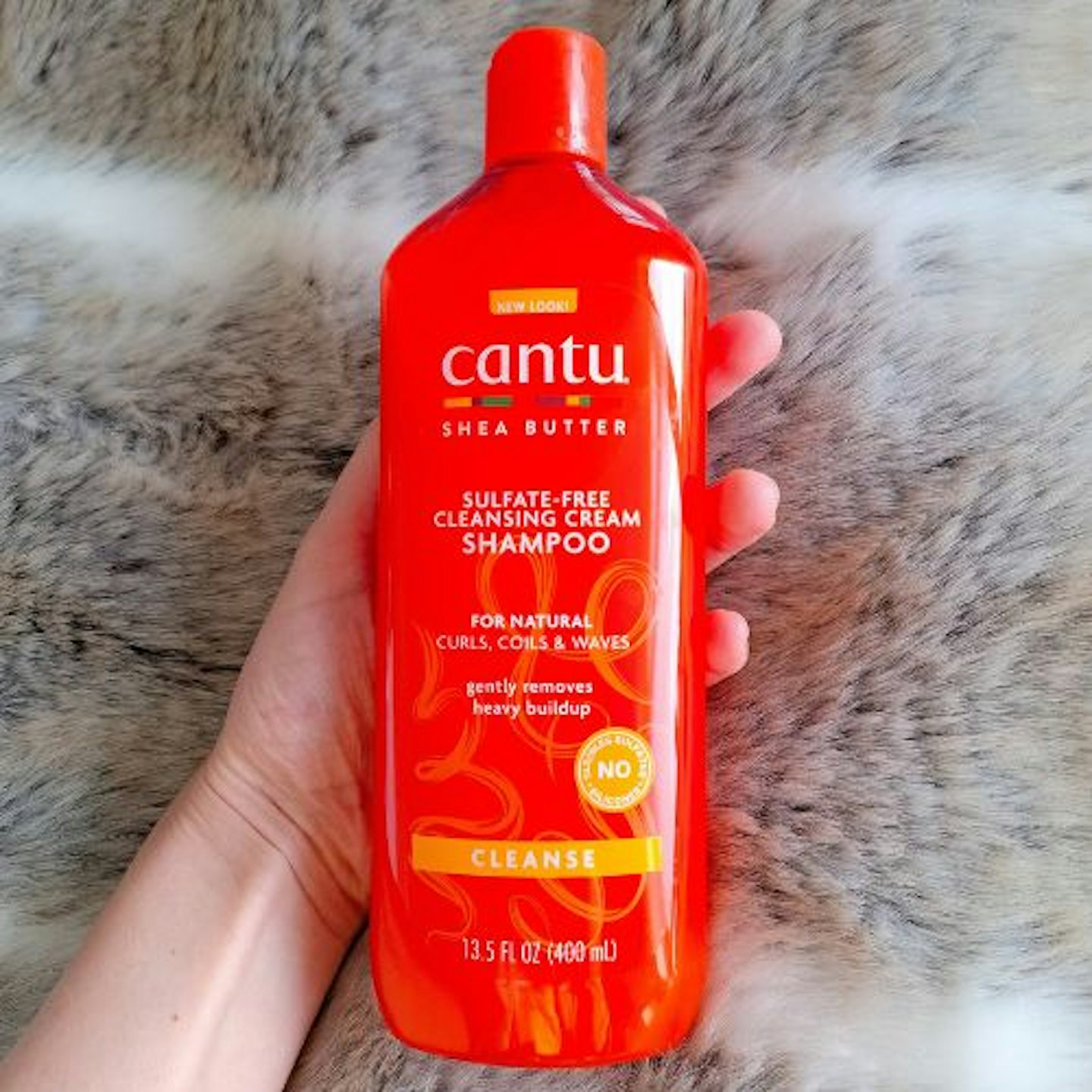 Cantu Cleansing Cream Shampoo close up of the front of the bottle