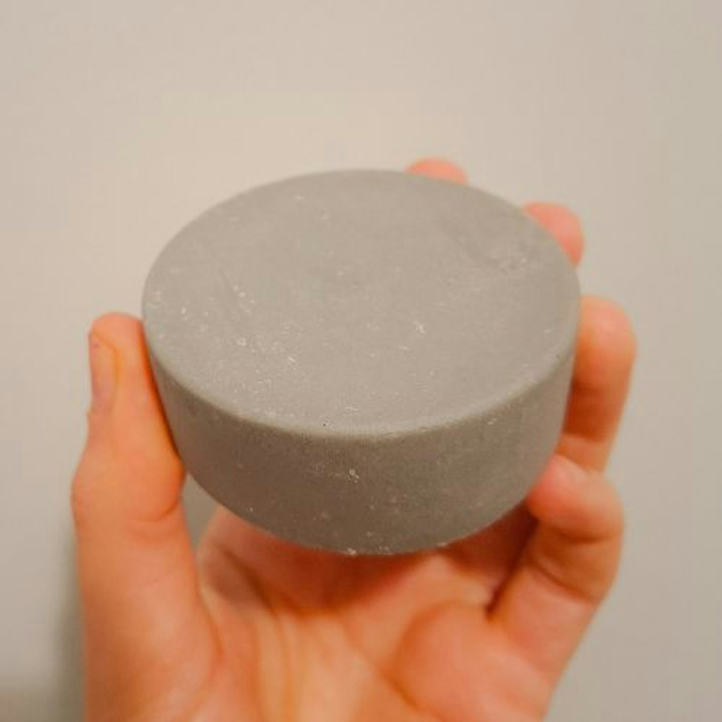 Kind2's 'Rebalancing One' shampoo bar in hand close up