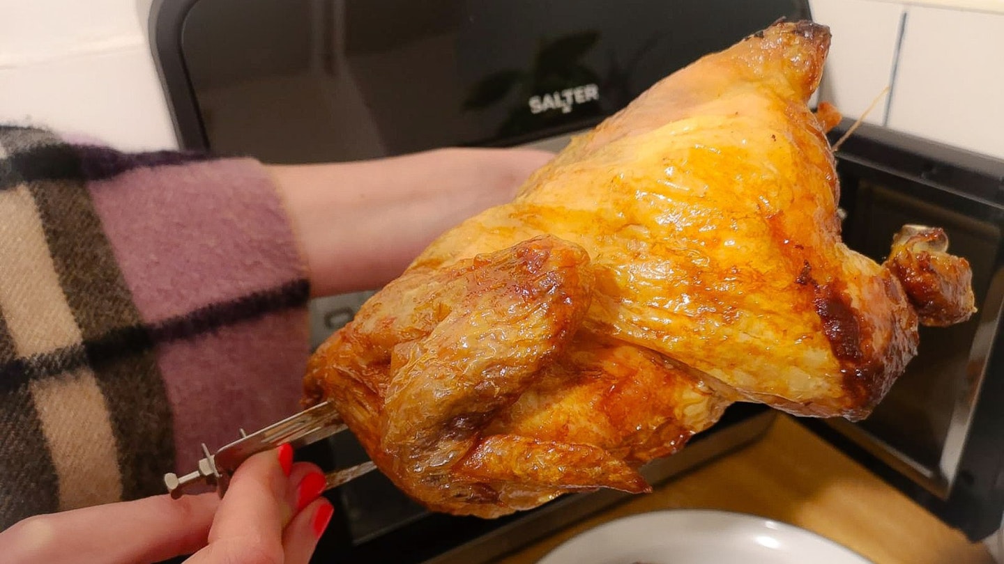 A whole roast rotisserie chicken cooked in the Salter French-Door Style XL Air Fryer Oven