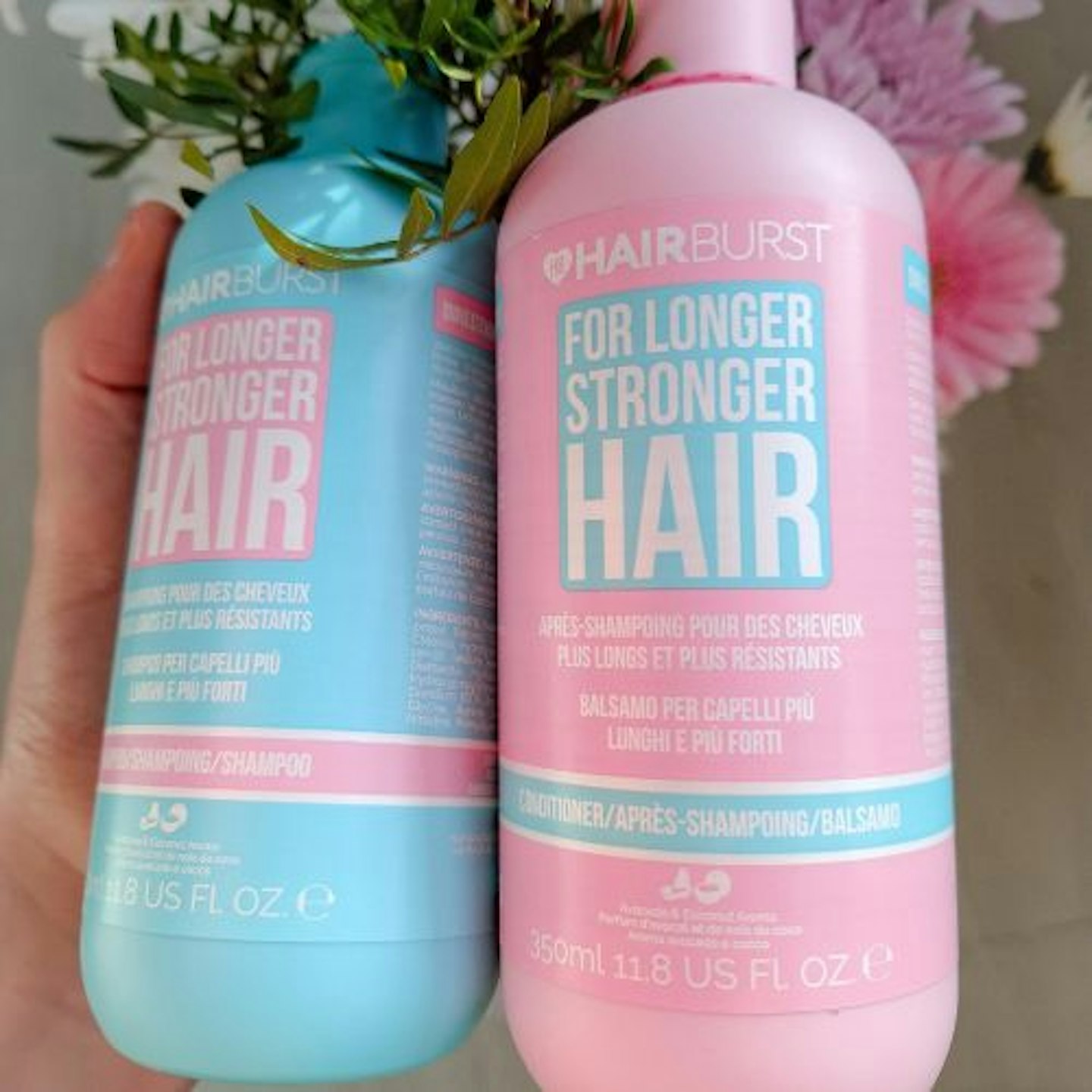 Close up of Hairburst Shampoo & Conditioner in particular the pink conditioner bottle