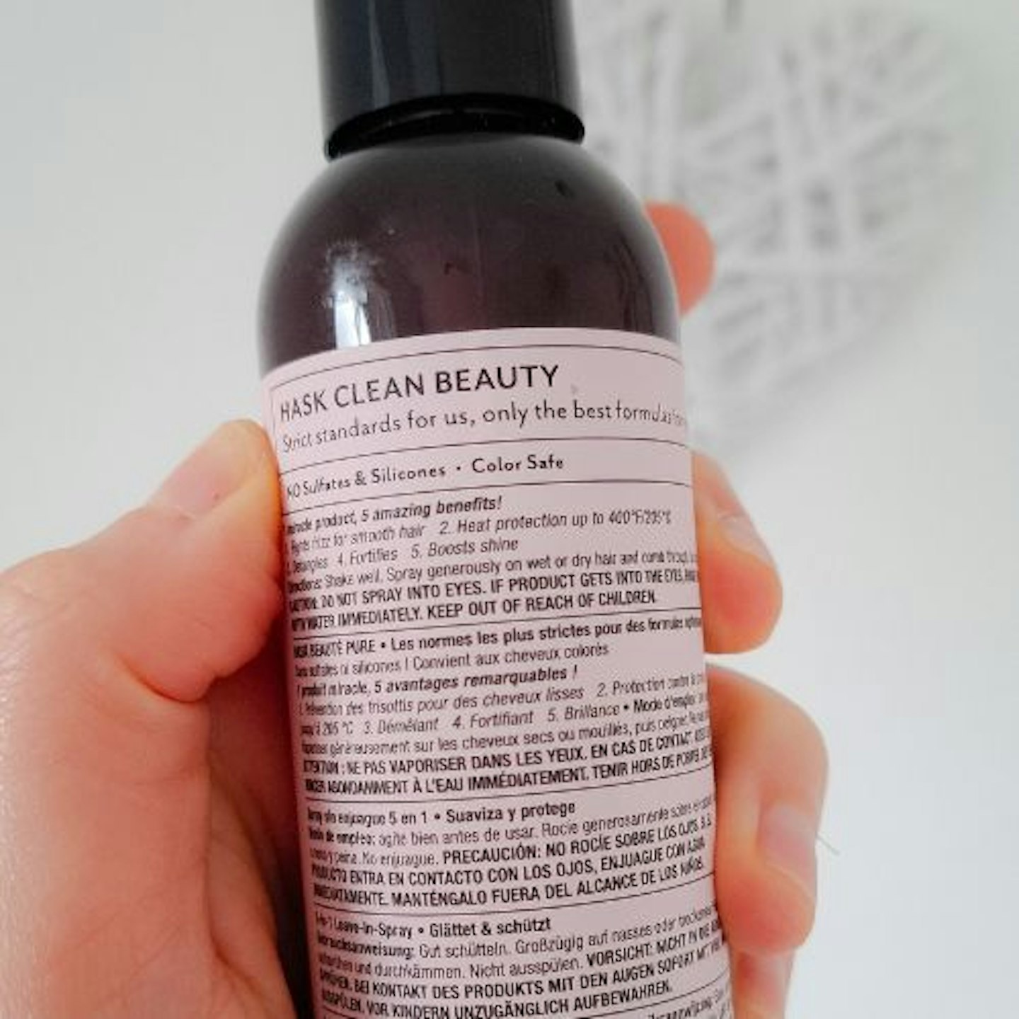 back of bottle, showing the text, on Hask Keratin Smooth 5-in-1 Leave-in Spray