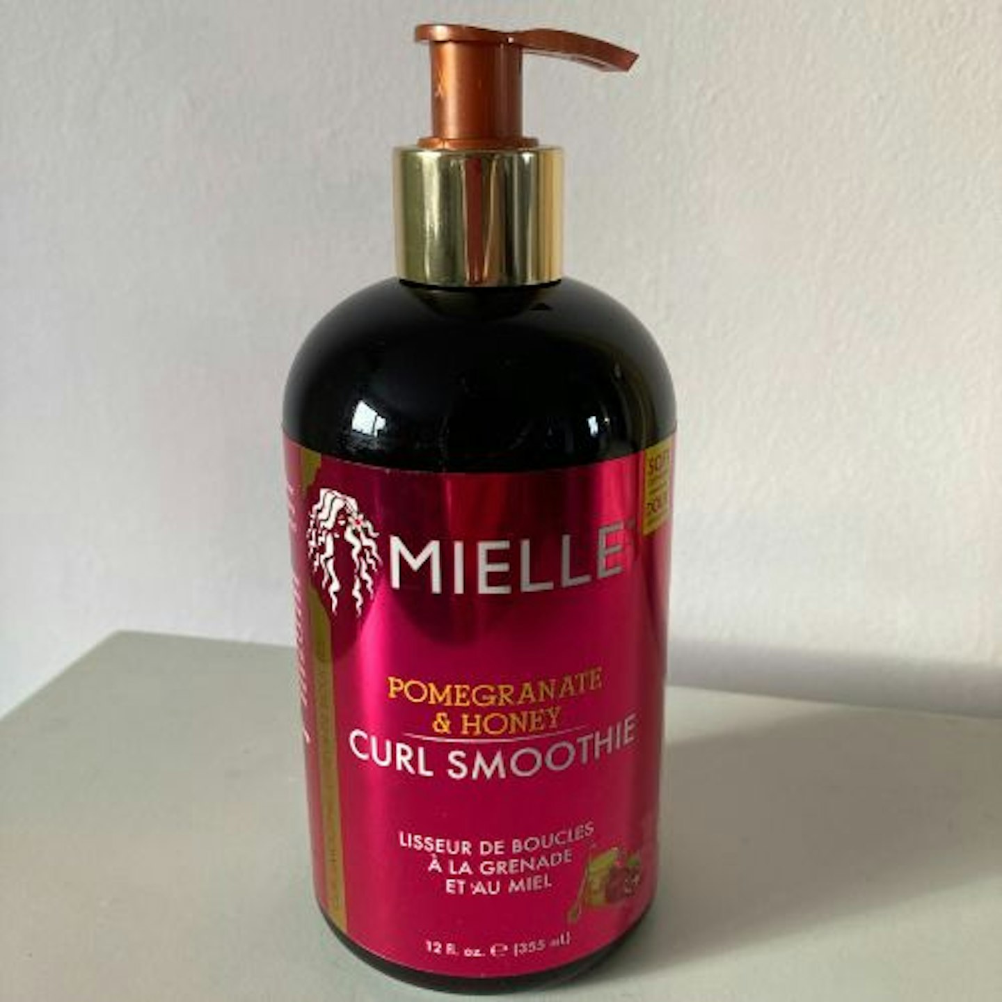 Image of a bottle of the Mielle Pomegranate & Honey Curl Smoothie