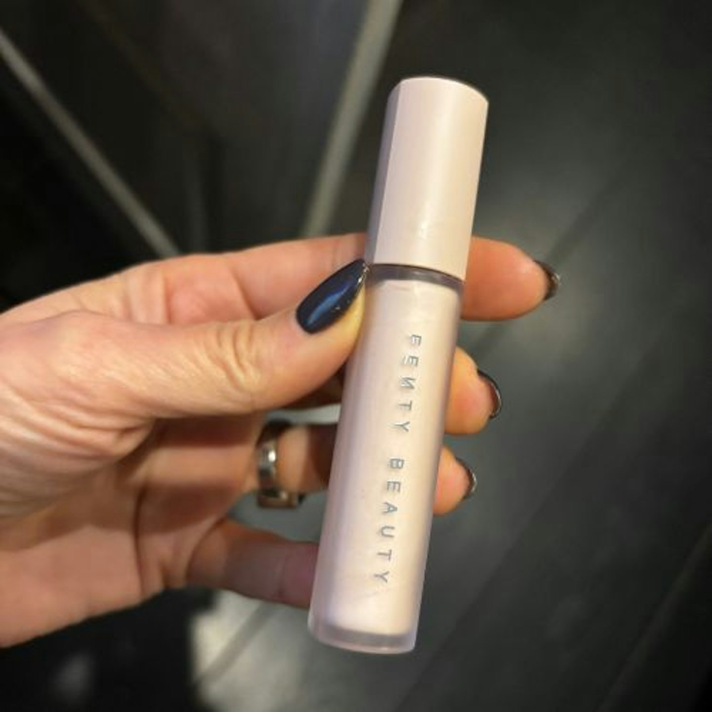 Suzanne holding the Fenty Beauty Pro Filt'r Amplifying Eye Primer