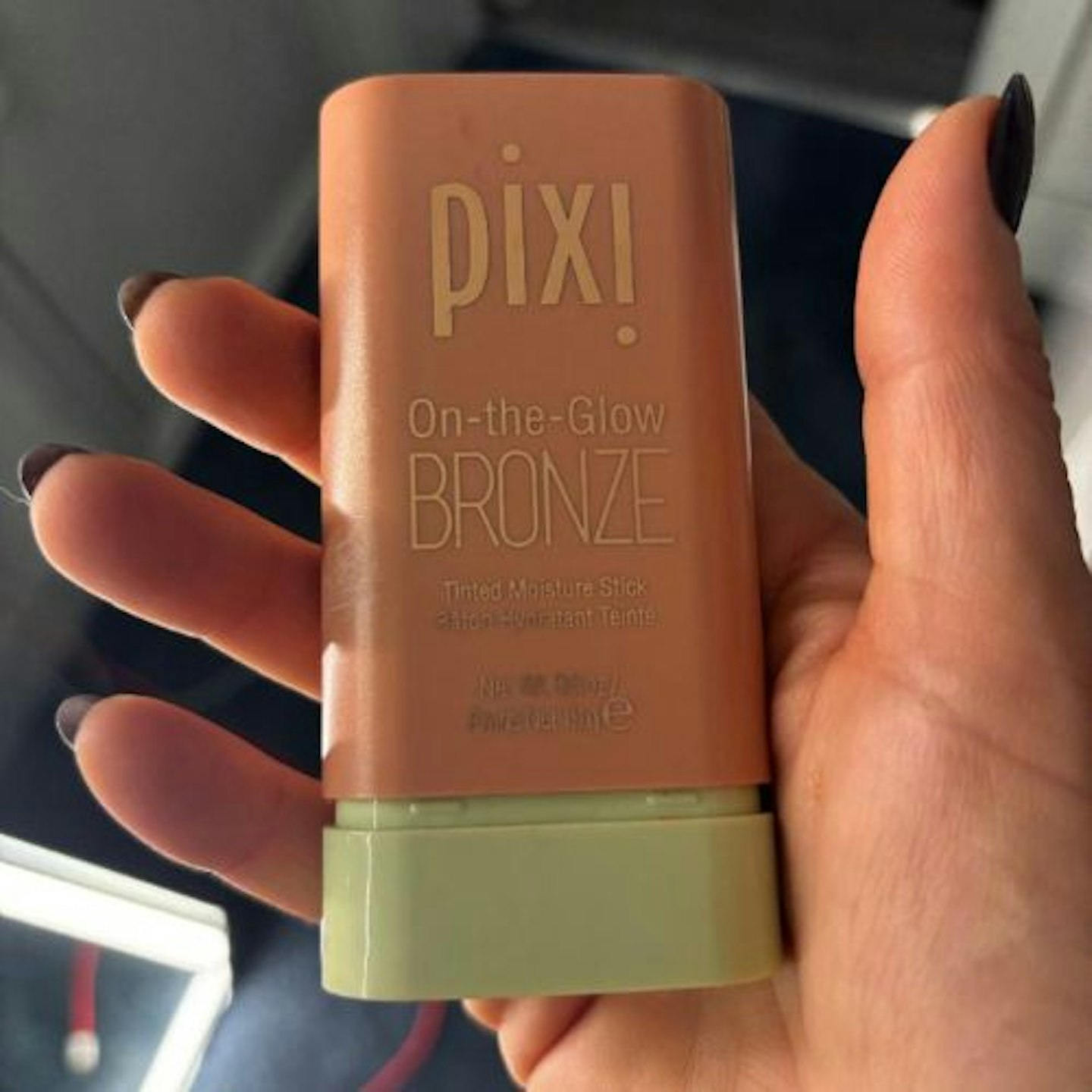 Suzanne holding the Pixi On-the-Glow Bronze