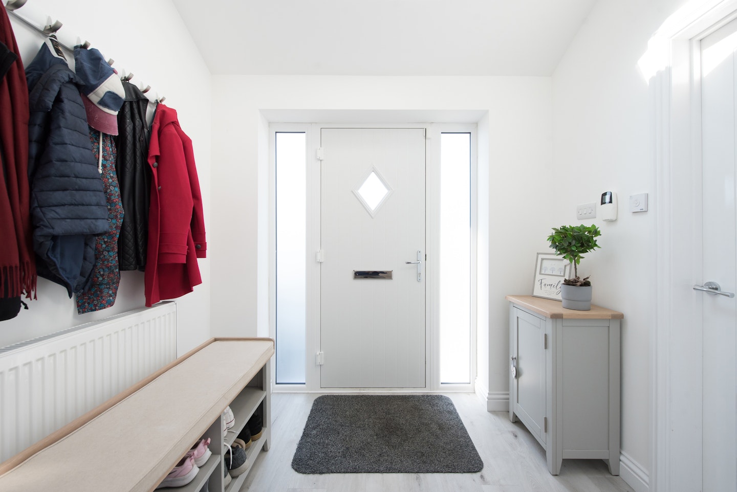 Coat and show storage area built in a hallway