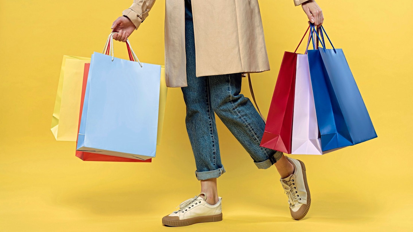 Cropped view of woman holding shopping bags