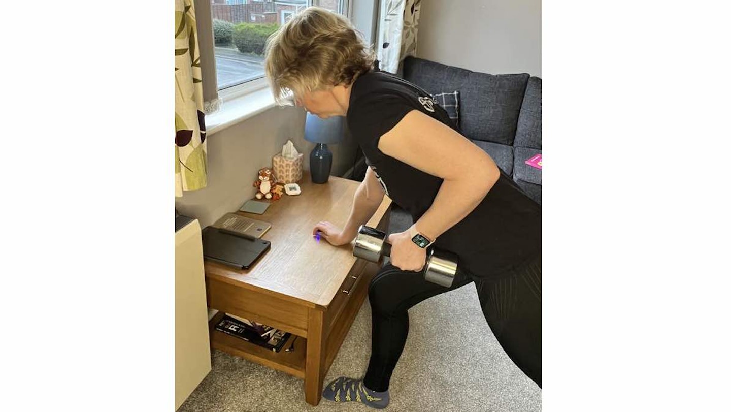 Woman doing a row with a dumbbell