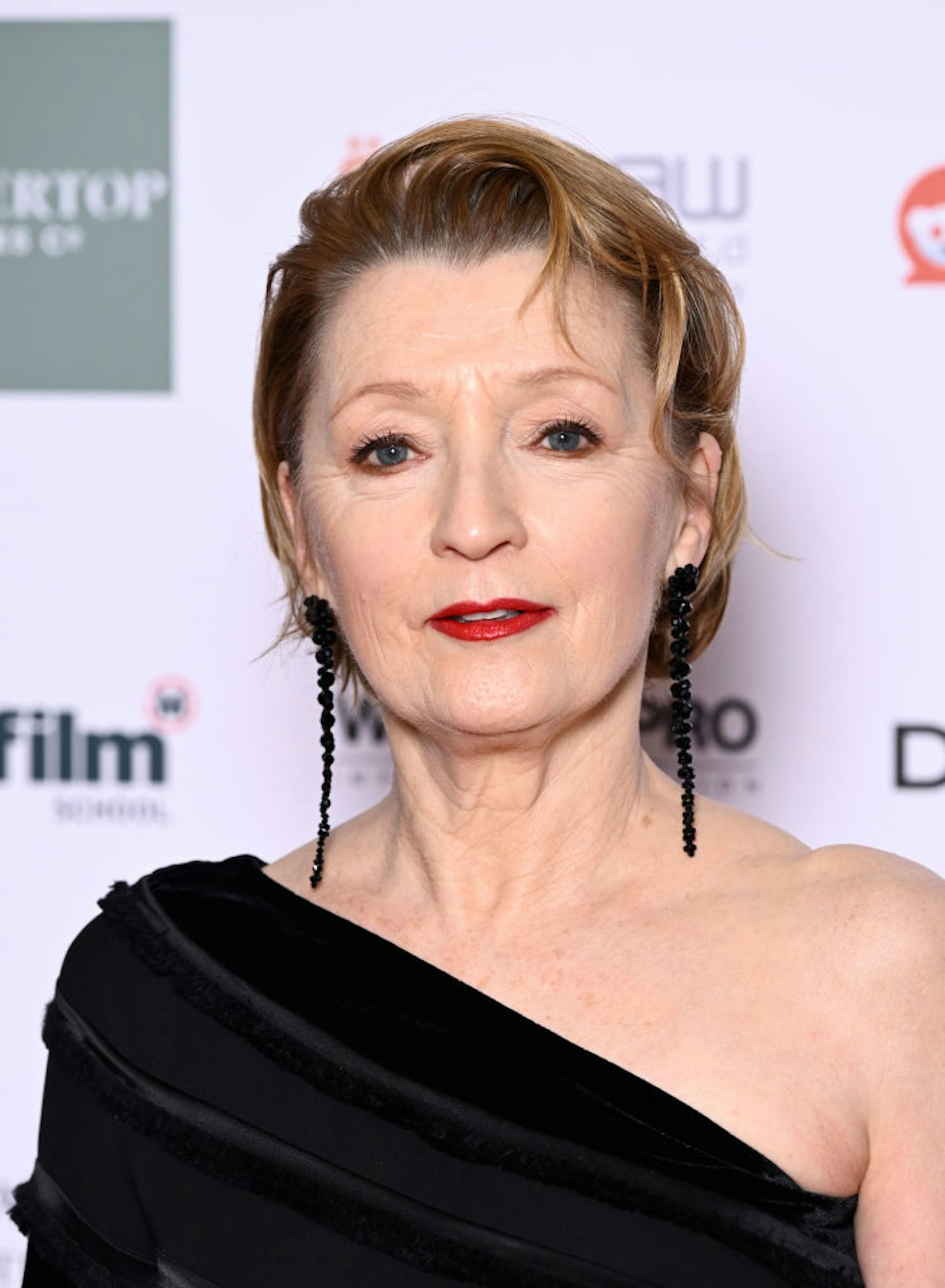 Lesley Manville in a black dress and a double eyeliner look