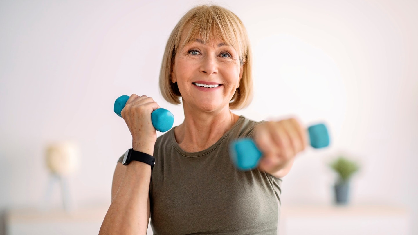 Woman using handheld weights