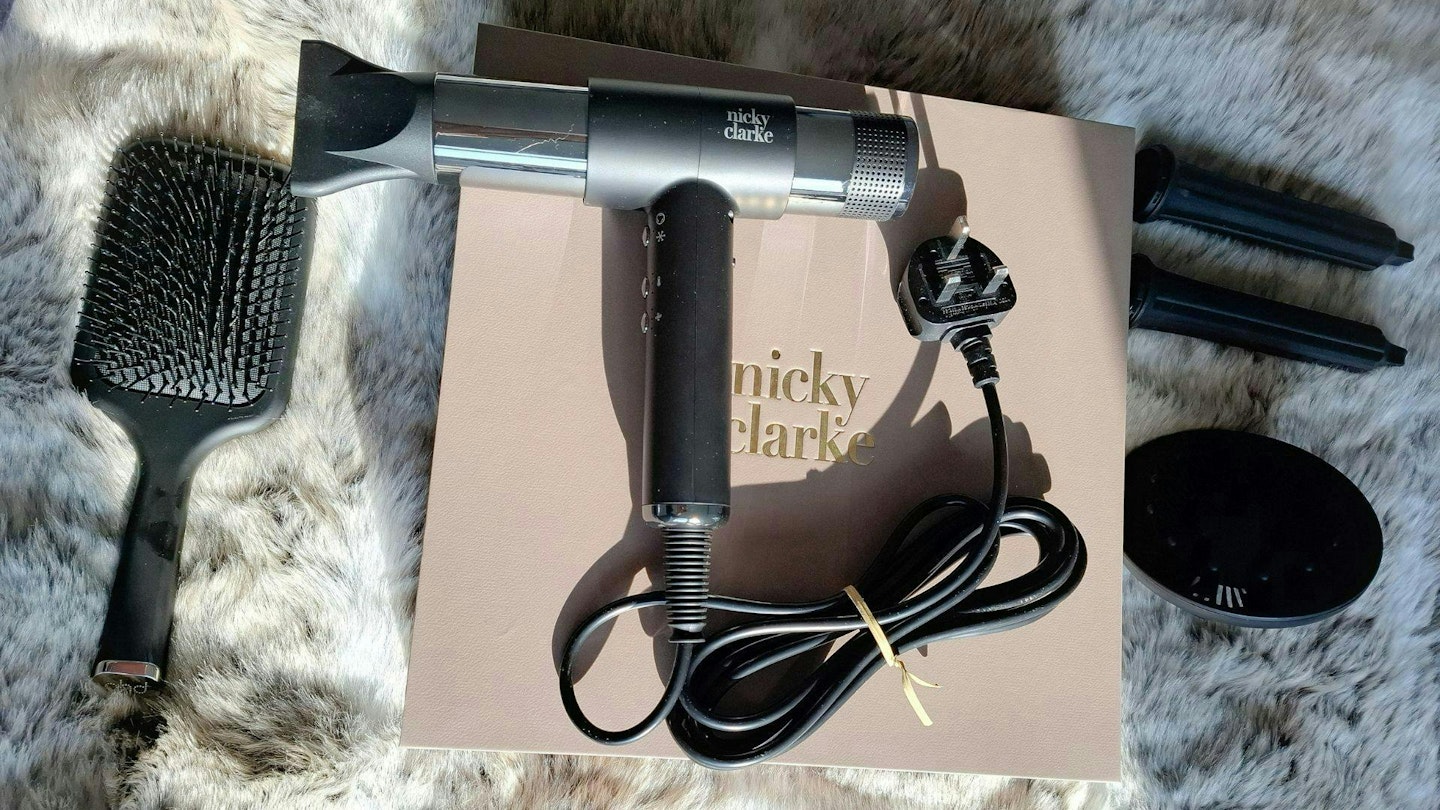 Nicky Clarke AirStyle Pro Hair Dryer & Styler size comparison next to a ghd paddle brush