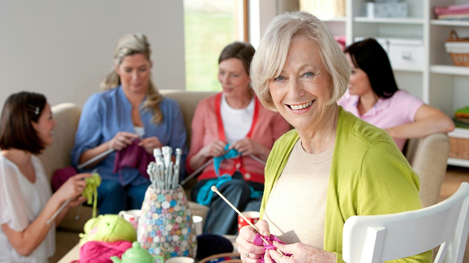 Group of women, each of them knitting