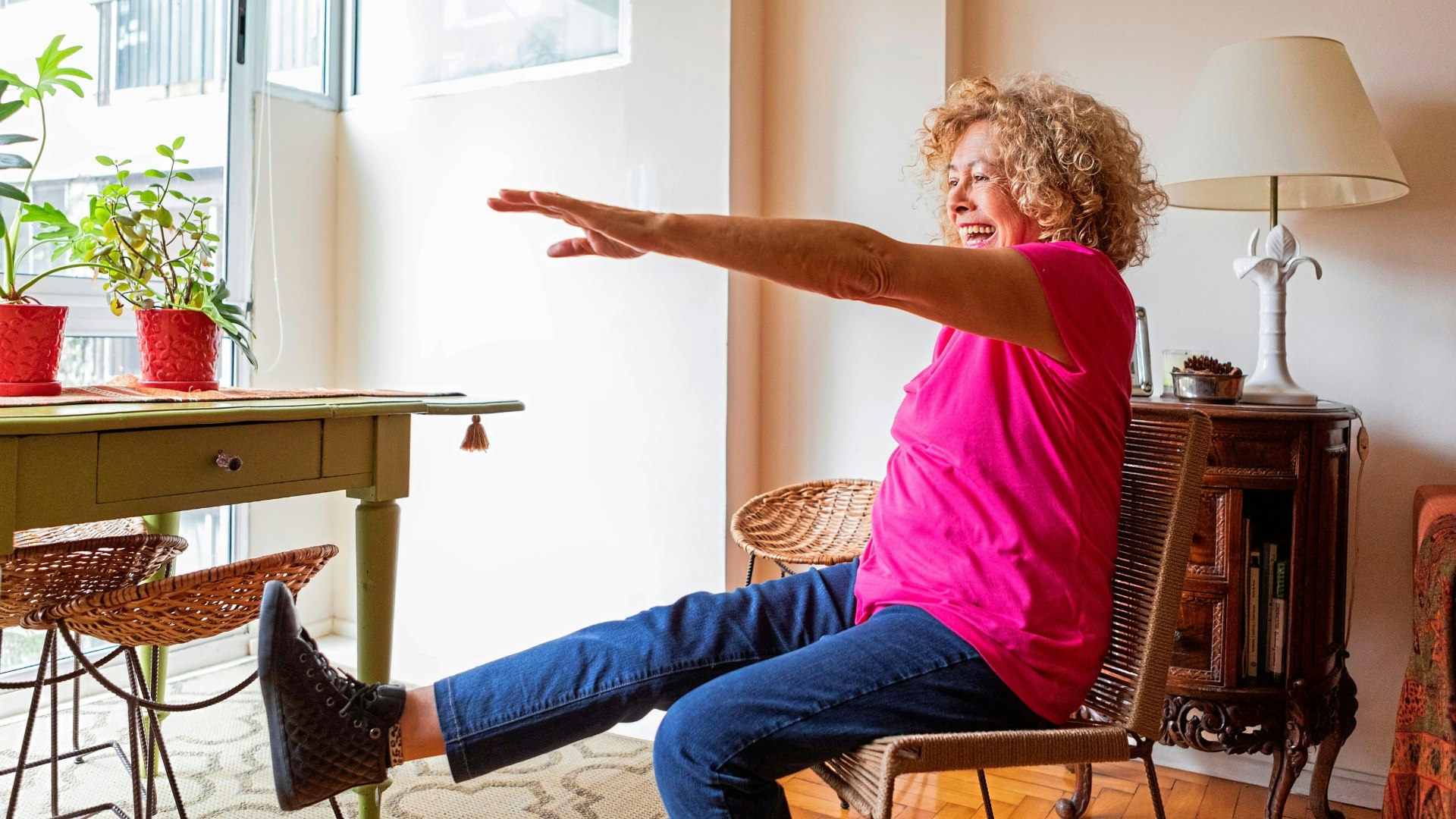 Senior woman doing physical therapy exercises at home