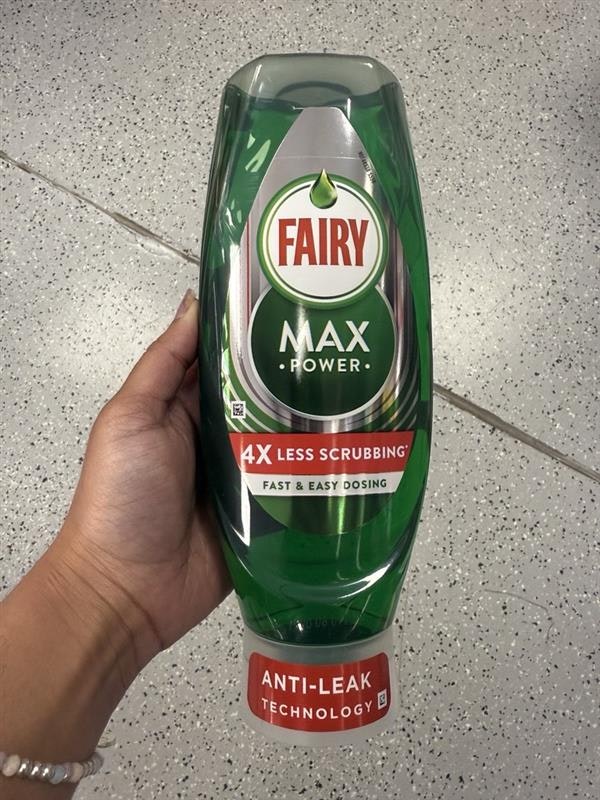 A woman holding Fairy liquid for cleaning