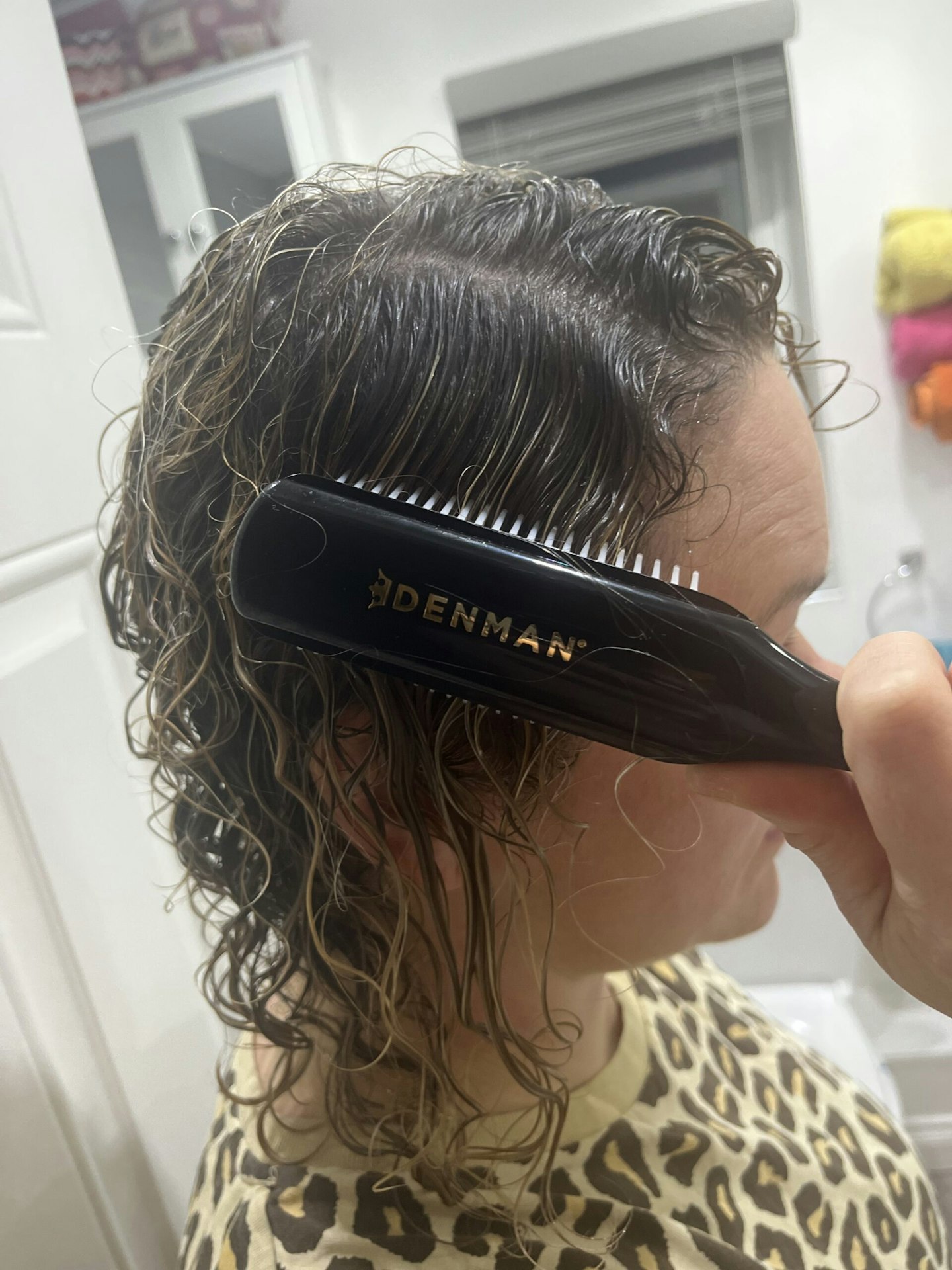 Tester using the Denman Curly Hair Brush D3