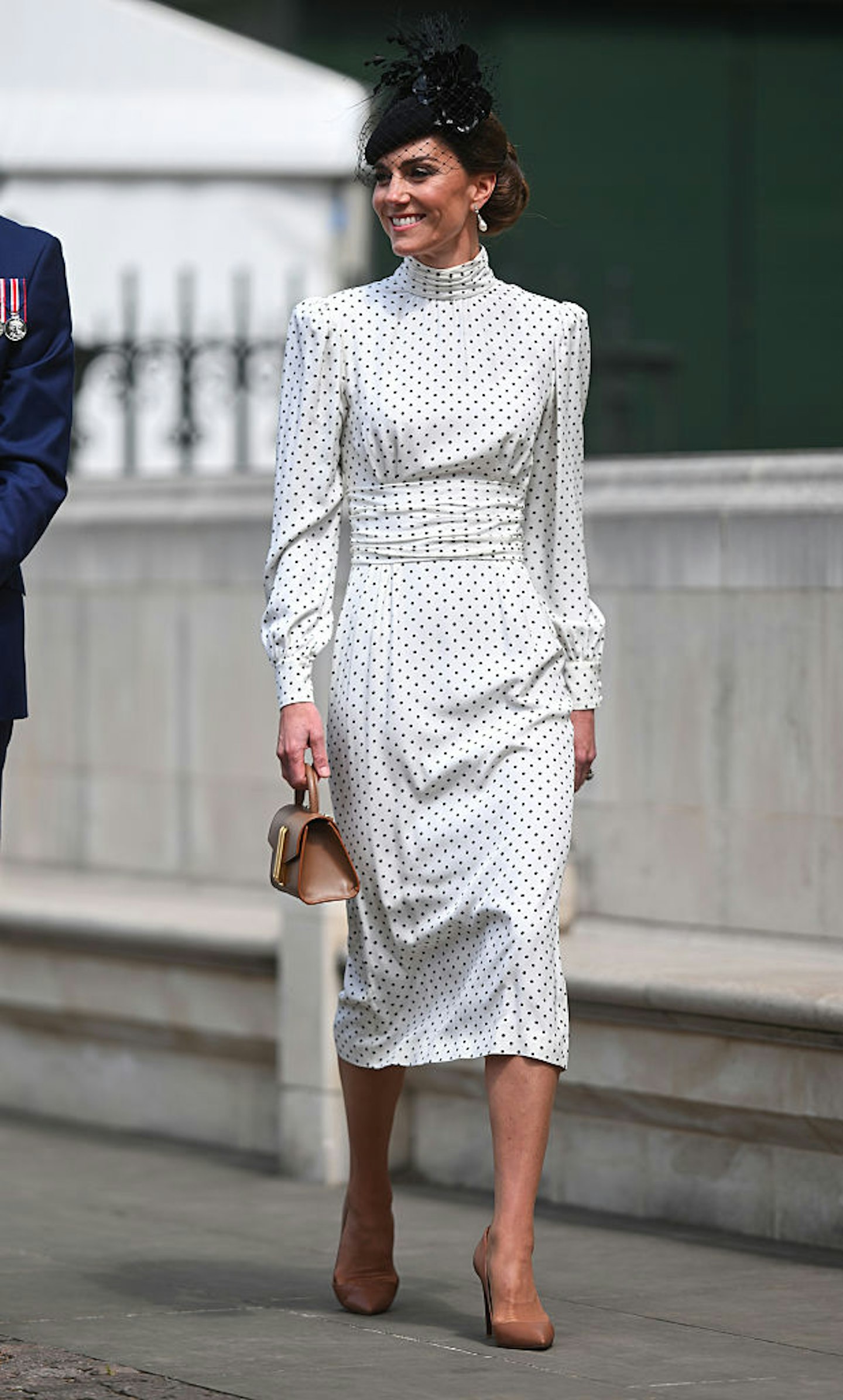 Kate Middleton wearing a white polka dot dress to attend the Thanksgiving Service To Mark The 80th Anniversary Of VE Day