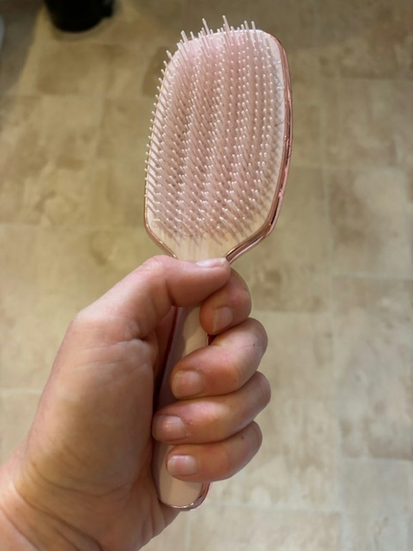 Tester holding the Lily England Curly Hair Brush