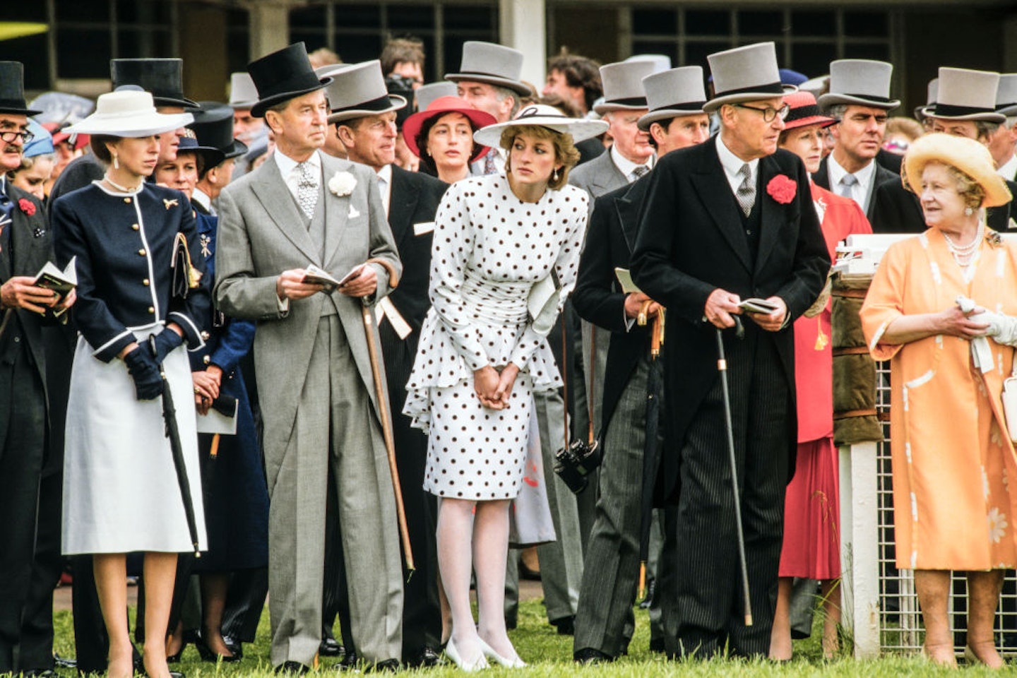 Princess Diana in a black and white, polka-dot dress and a matching, wide-brimmed hat, at the Epsom Derby in 1986