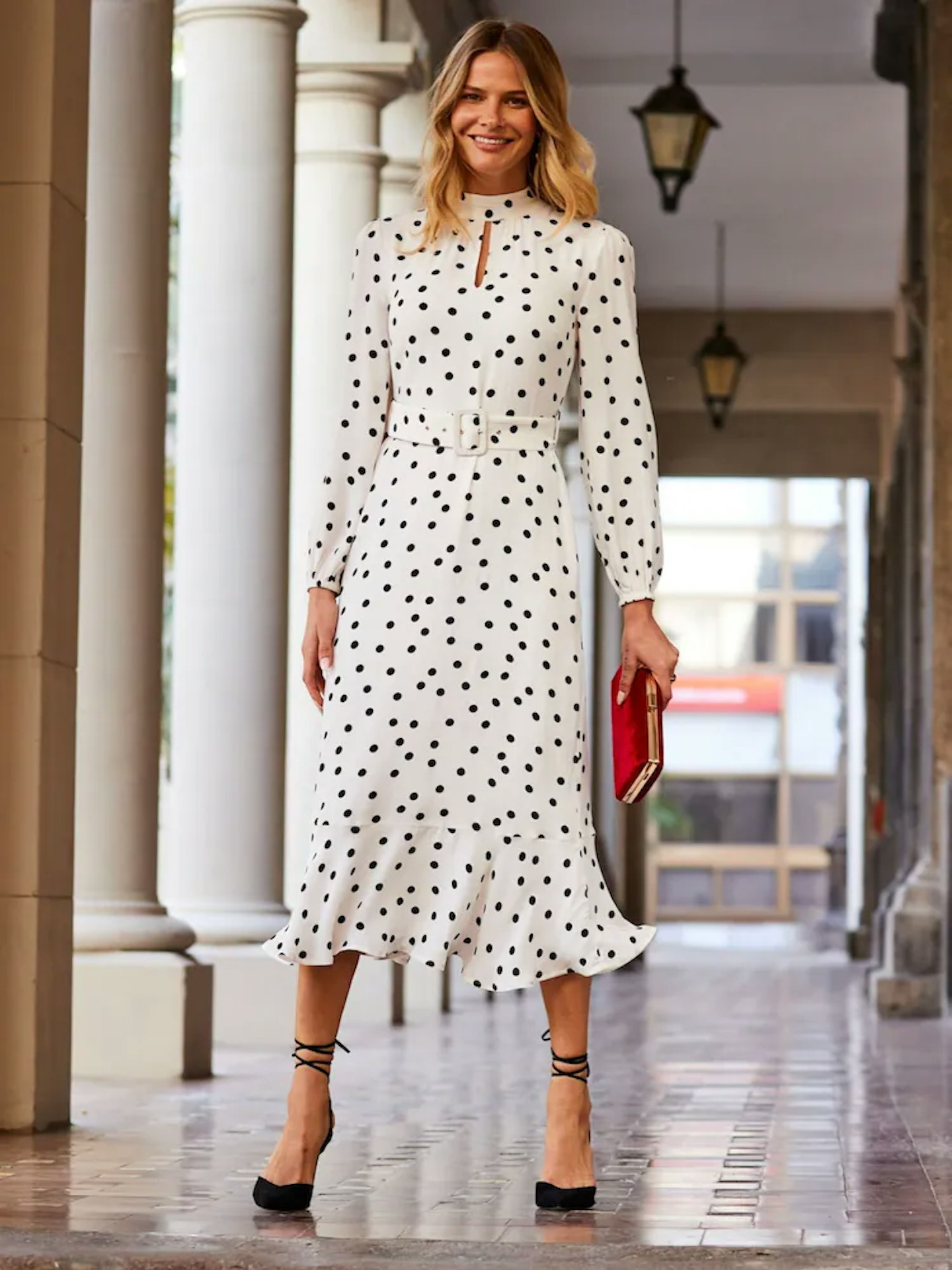 Model wearing the Sosandar White Spot Print Keyhole Detail Belted Fit & Flare Dress