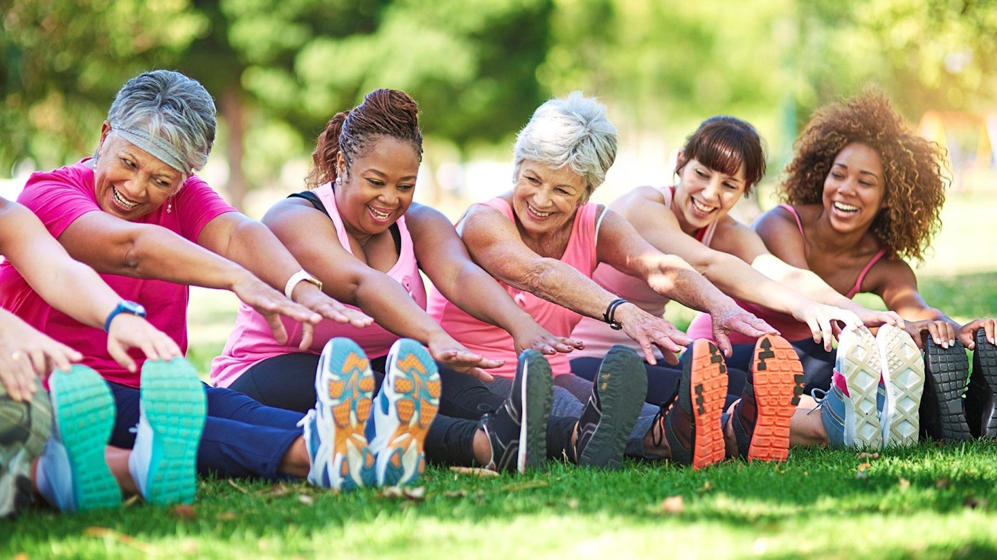 Group of women doing exercises in the park