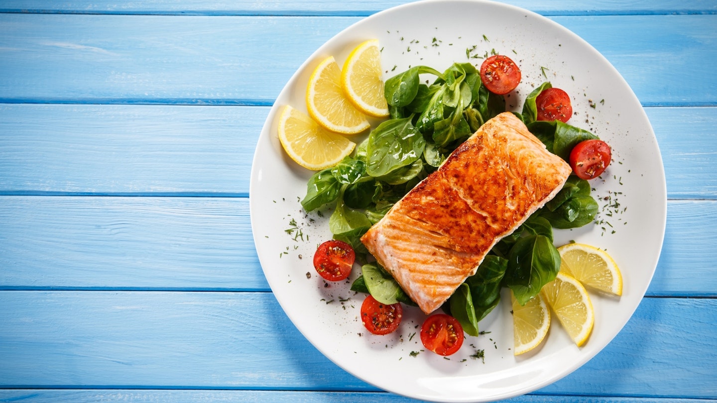 Plate of fish with fresh salad