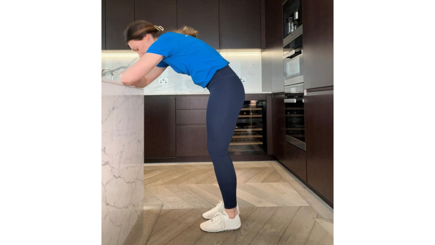 Woman doing the standing cat