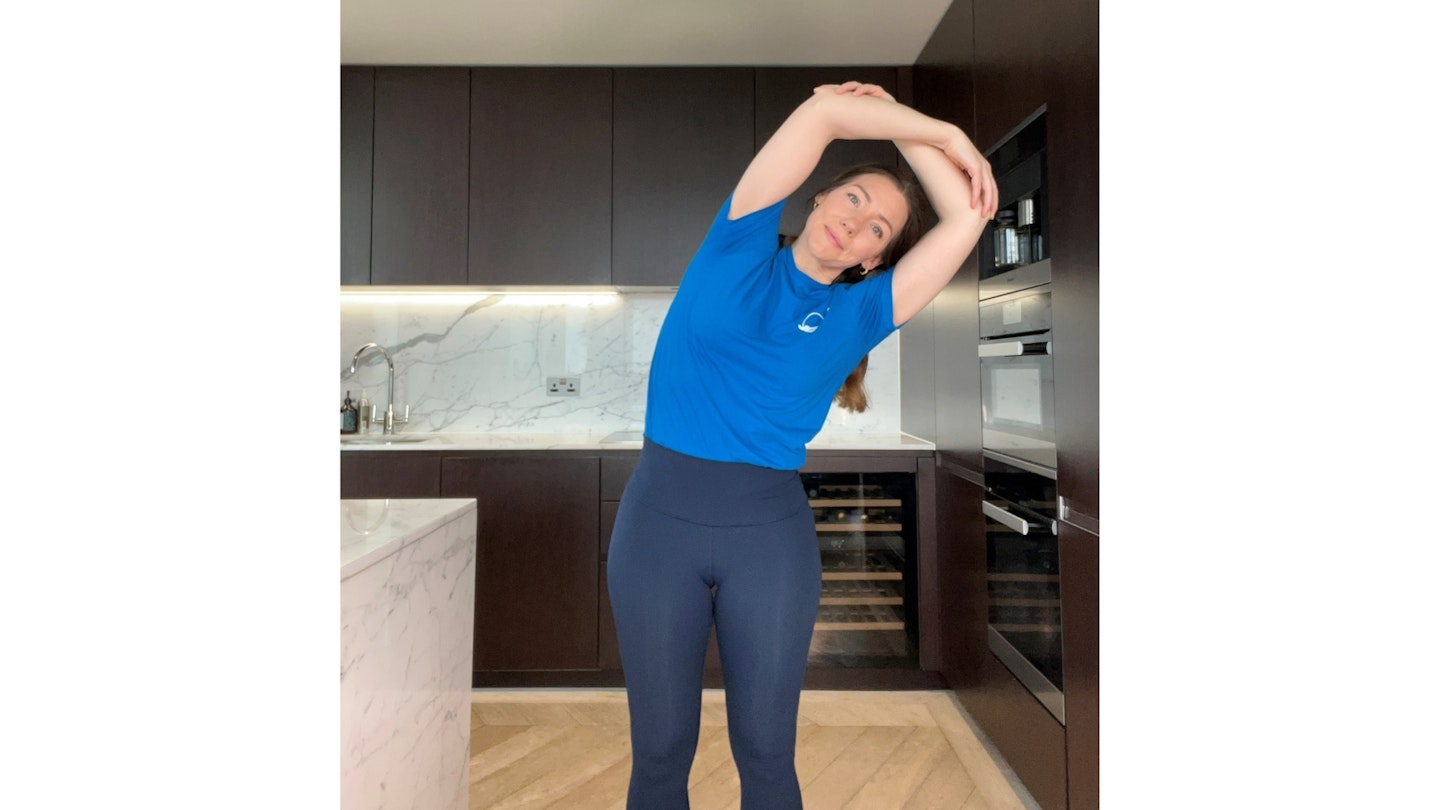 Woman raising her arms over her head