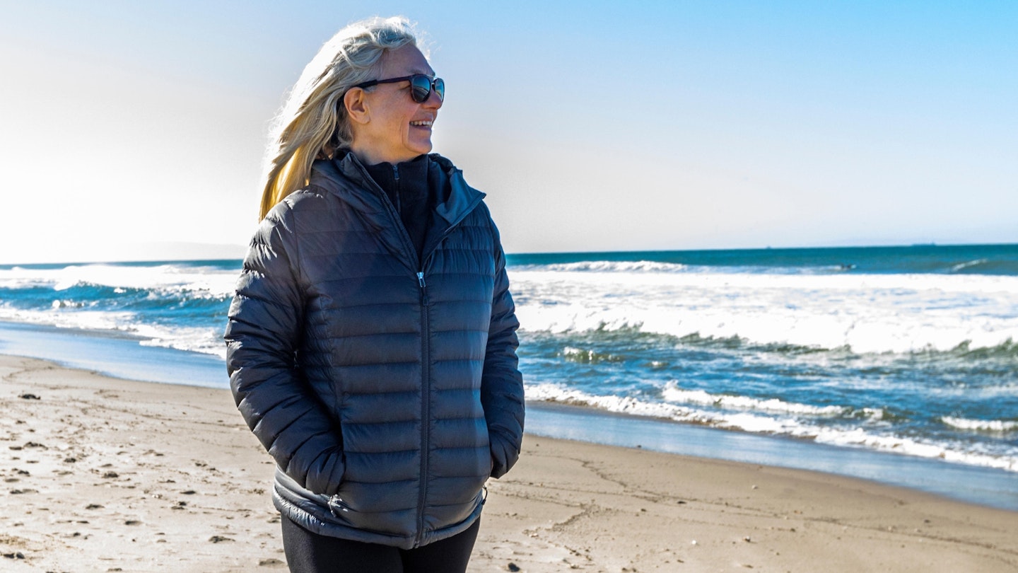 Mature woman walking on beach