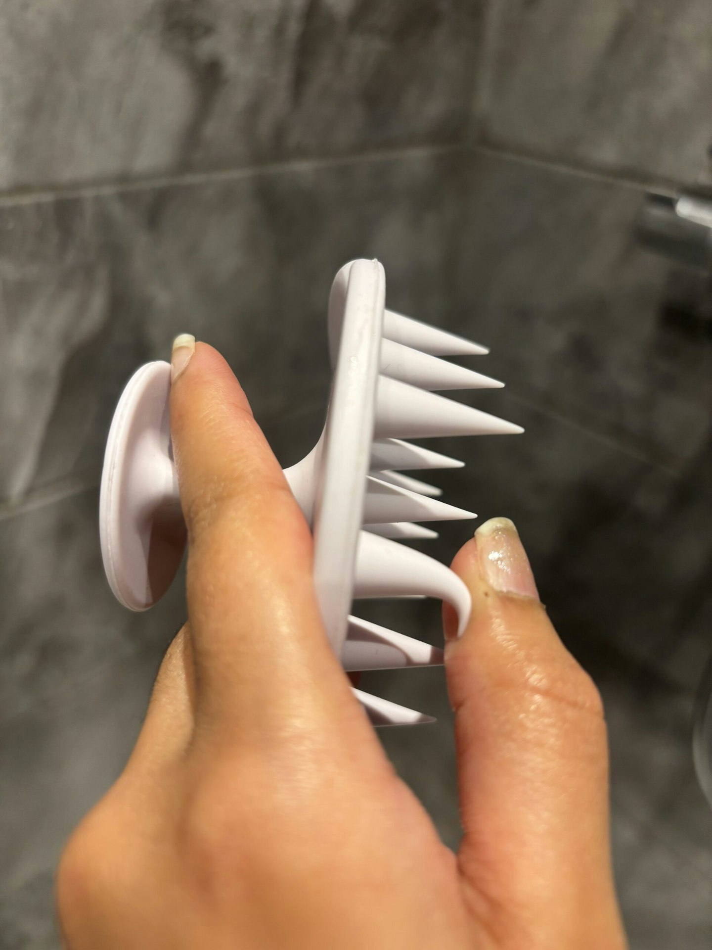 Tester showing the tips of the Boots Scalp Massage Brush