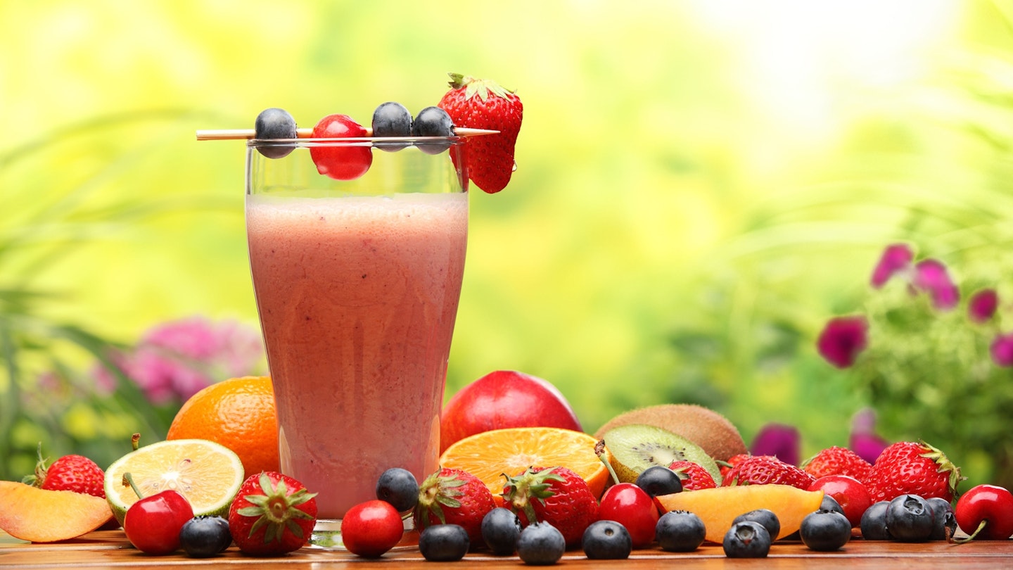 Glass of smoothie with fresh fruits