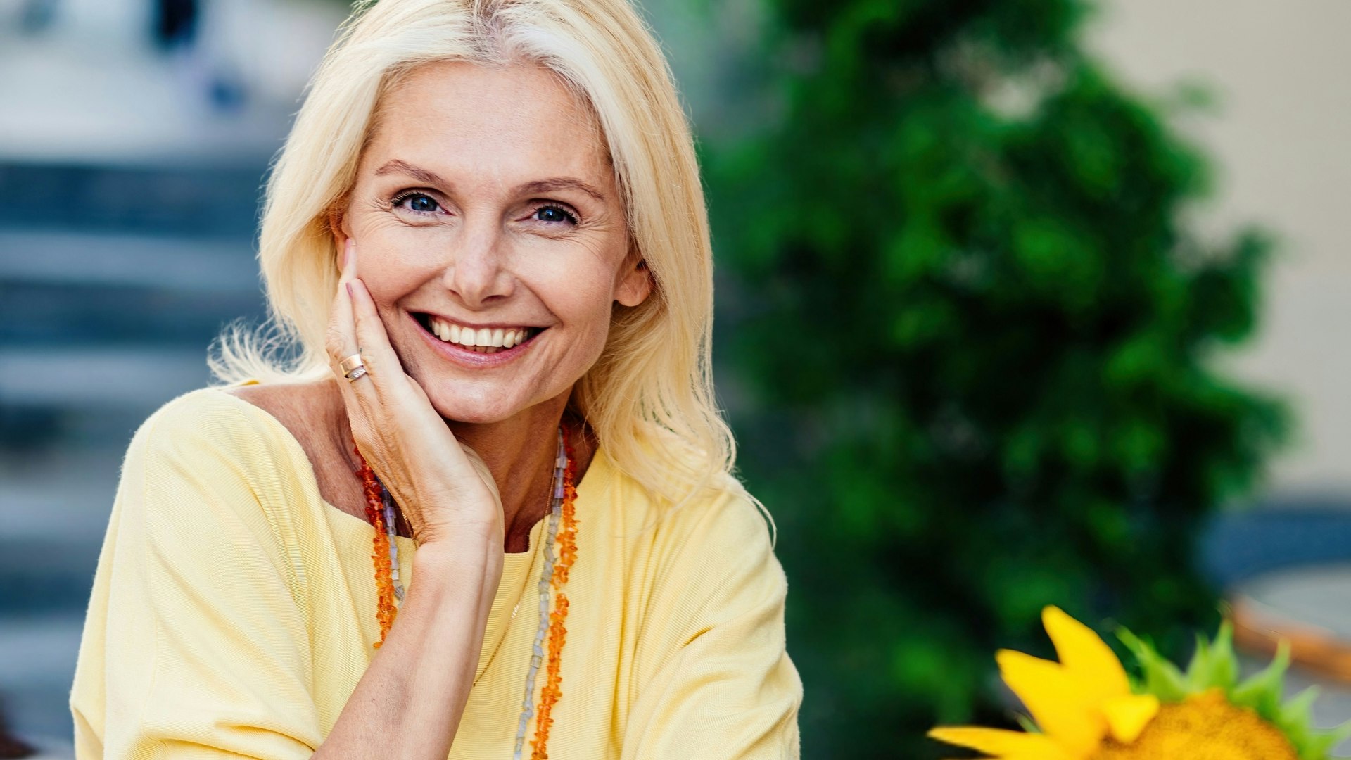 happy senior adult woman sitting