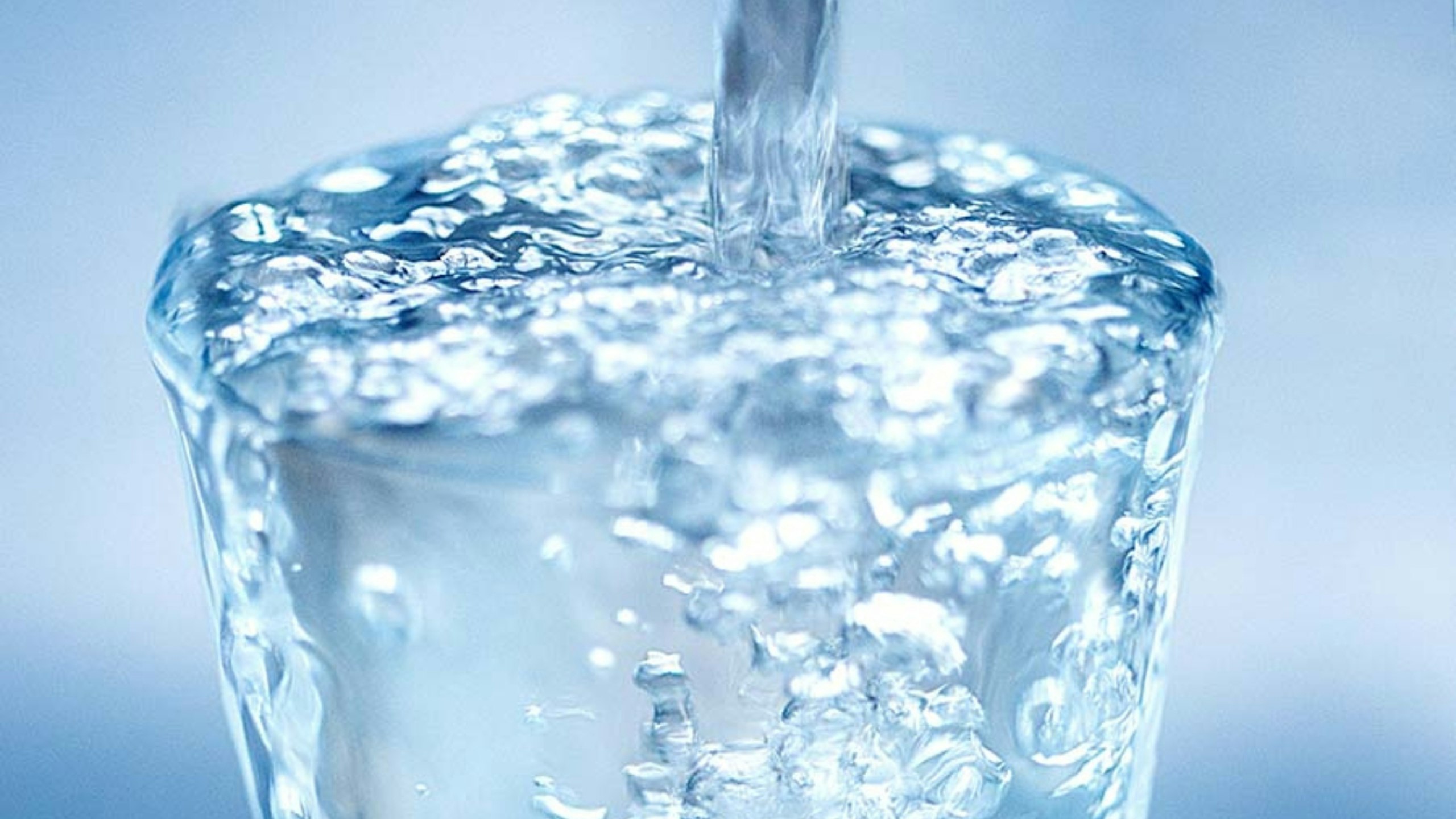 water poring into glass