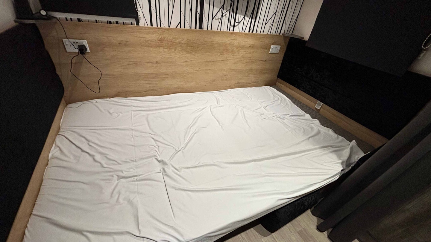 The dining table converted into a bed at Rockley Park Glamping Pod