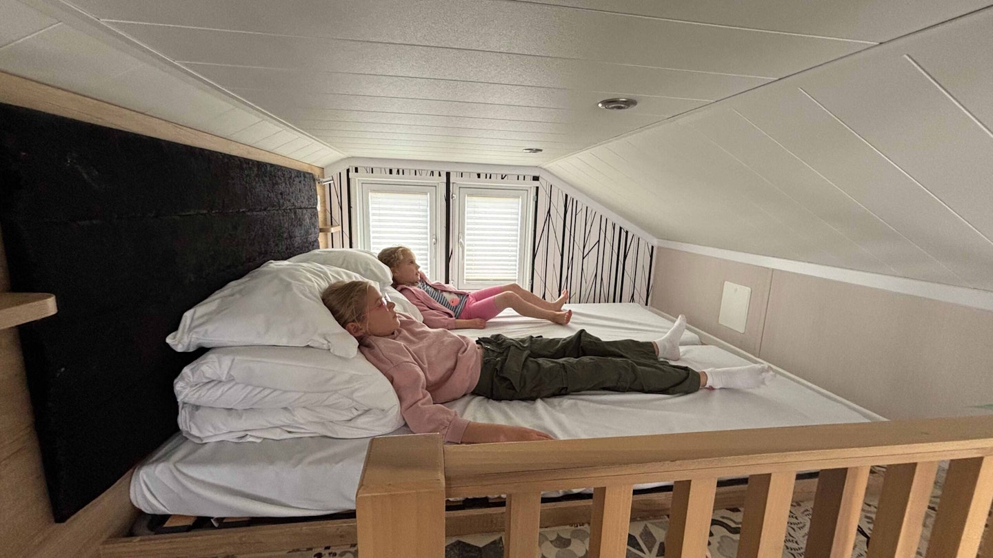 The upstairs bed in a Rockley Park glamping pod